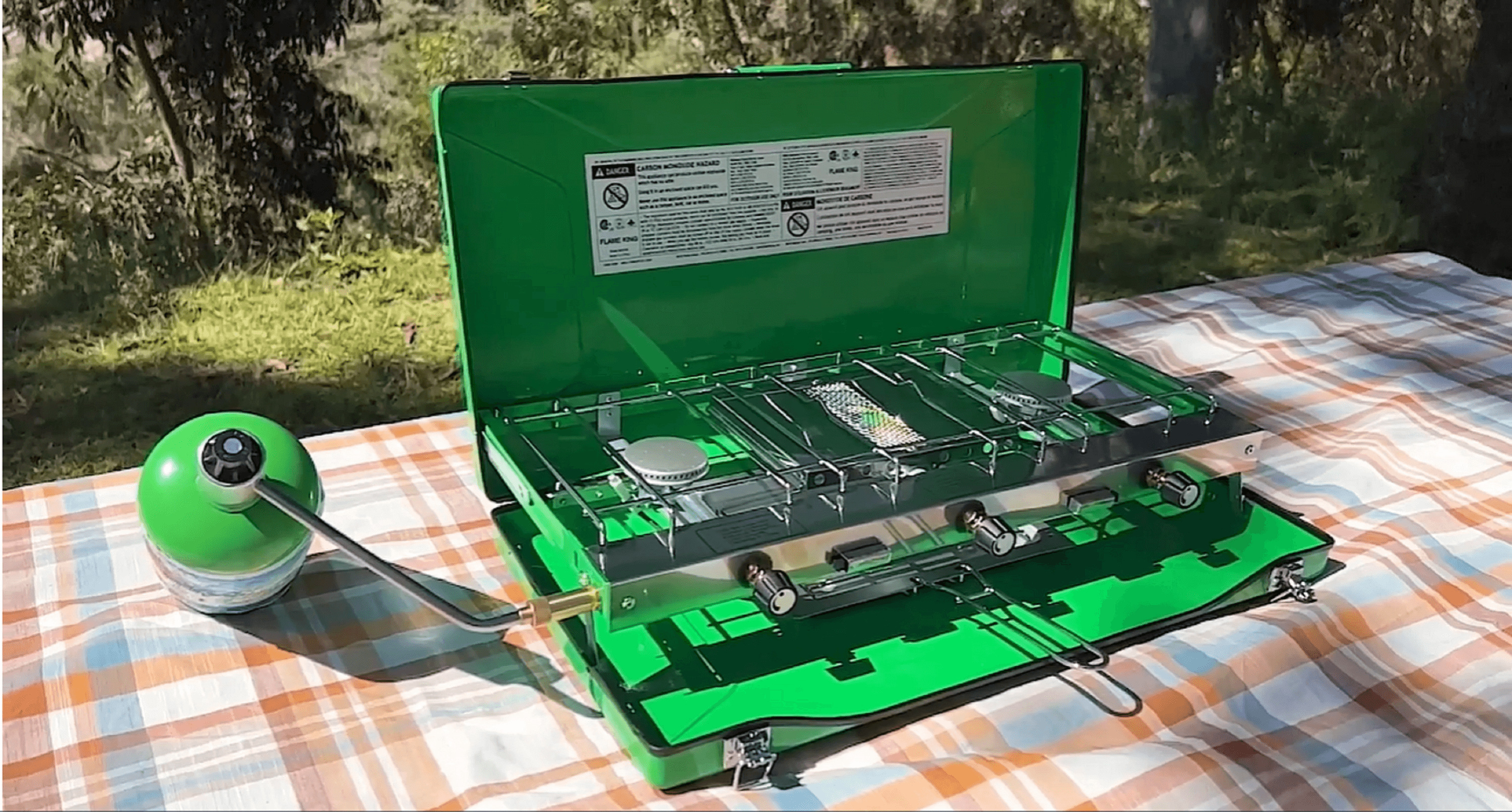 Flame King portable 3 burner grill with propane gas and toast tray for camping, showcasing burners and cooking surface.
