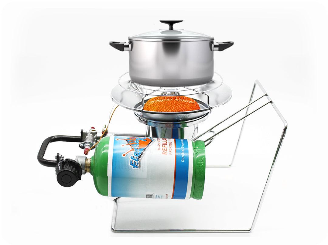 Portable Flame King burner cooker heater for camping, with a sturdy metal frame and adjustable flame control.