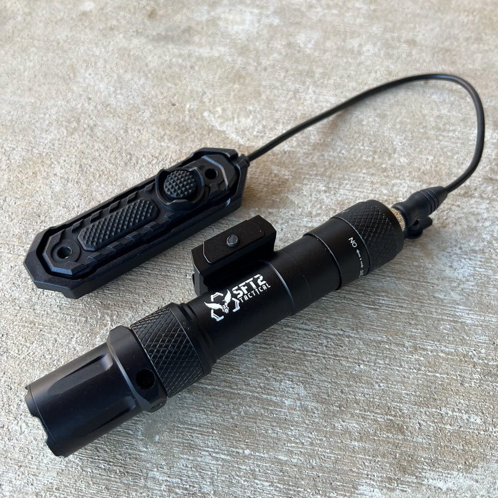 SFT2 Tactical RM19 Tac-Light mounted on a weapon, showcasing its compact design and bright illumination features.