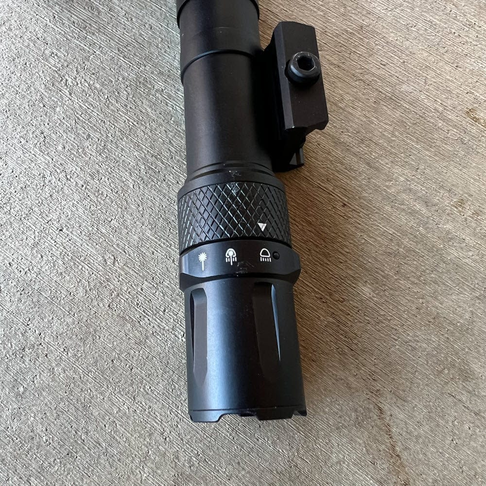SFT2 Tactical RM19 Tac-Light weapon light with laser mounted on a firearm for tactical illumination and targeting.