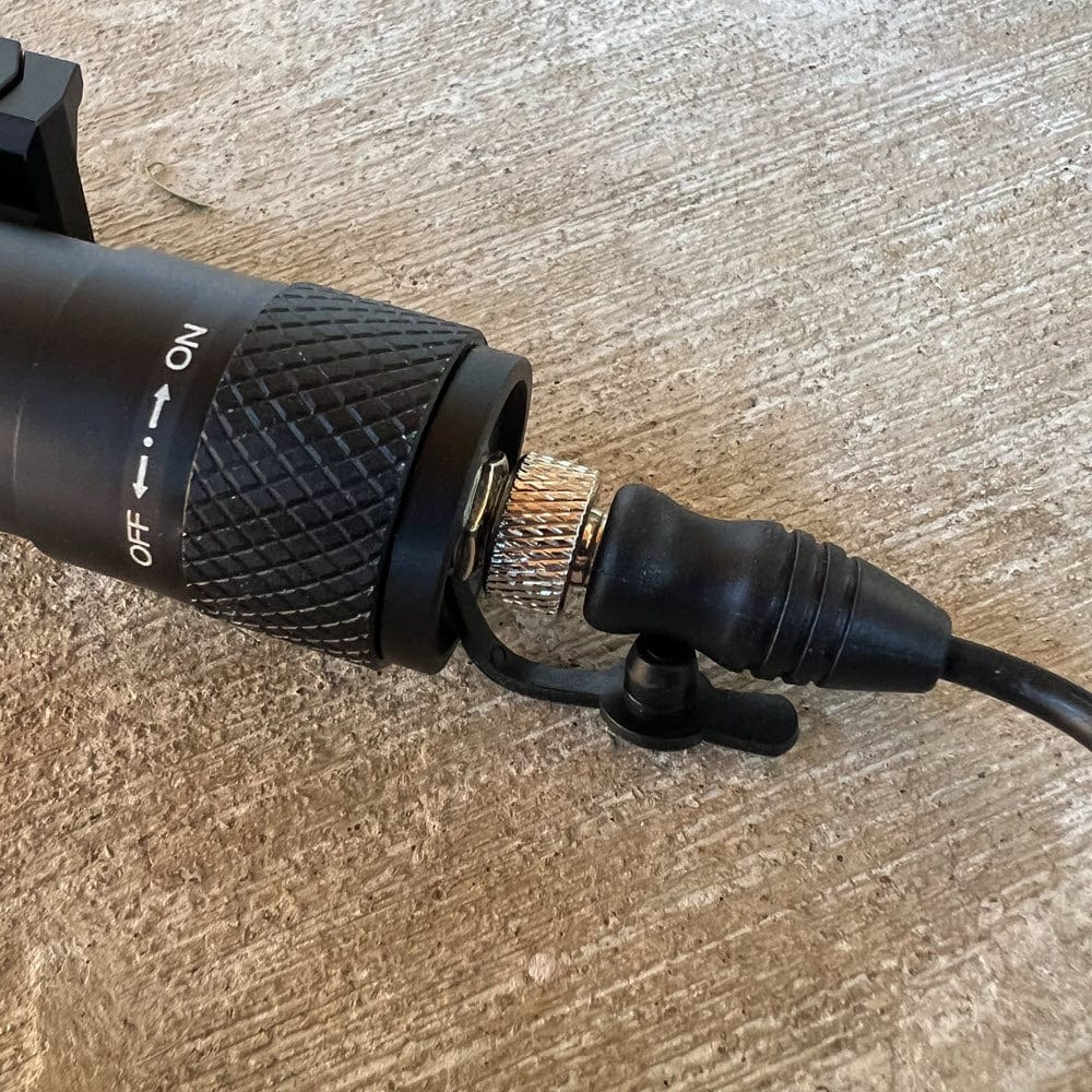 SFT2 Tactical RM19 Tac-Light mounted on a firearm, showcasing its compact design and bright illumination feature.