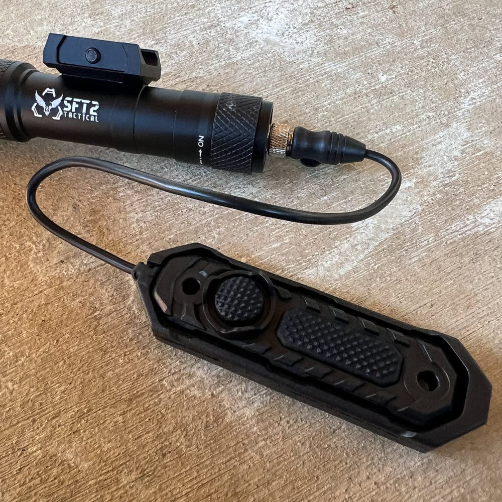 SFT2 Tactical RM19 Tac-Light weapon light with laser mounted on a firearm for tactical use and improved visibility.