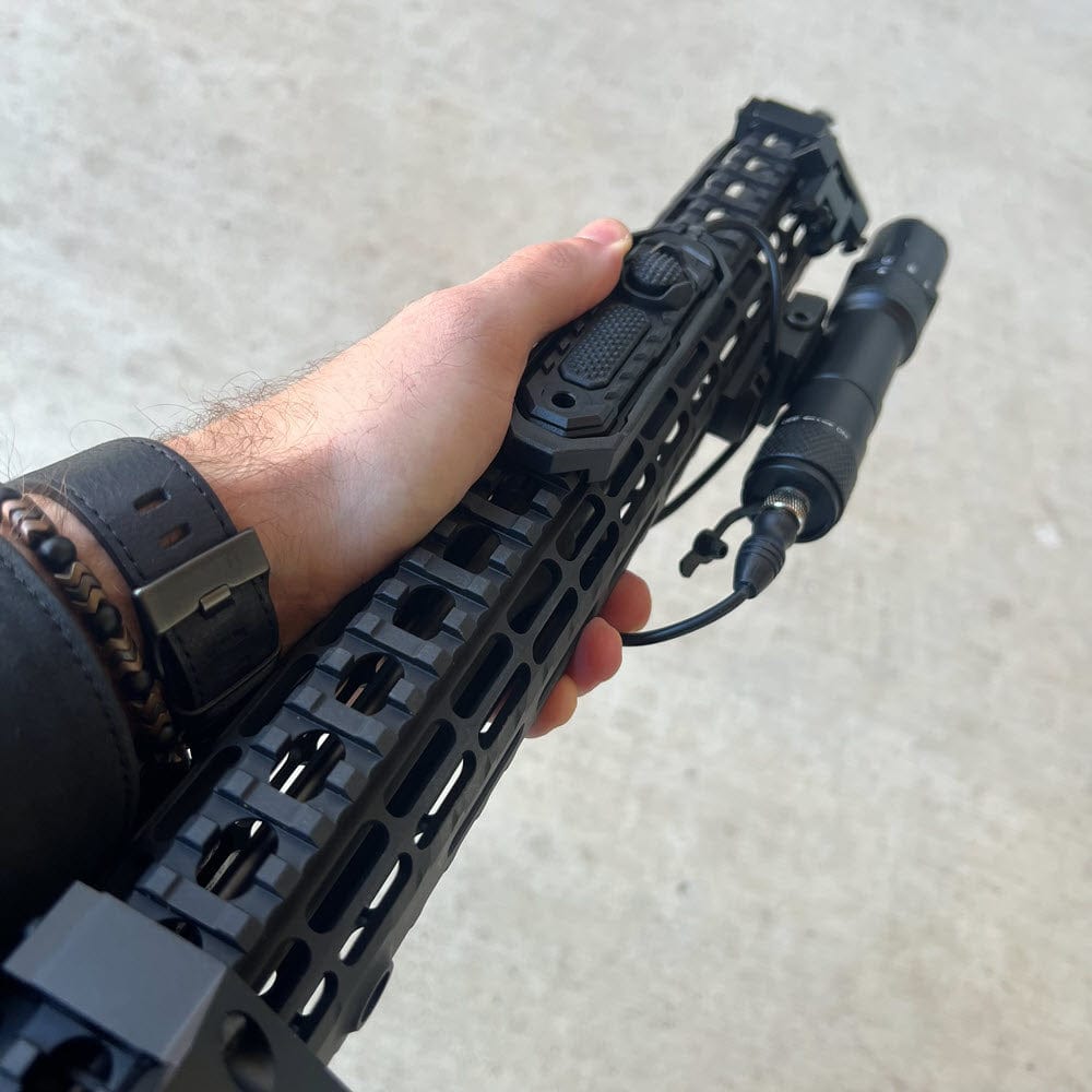 SFT2 Tactical RM19 Tac-Light weapon light and laser mounted on a firearm for tactical illumination and targeting.