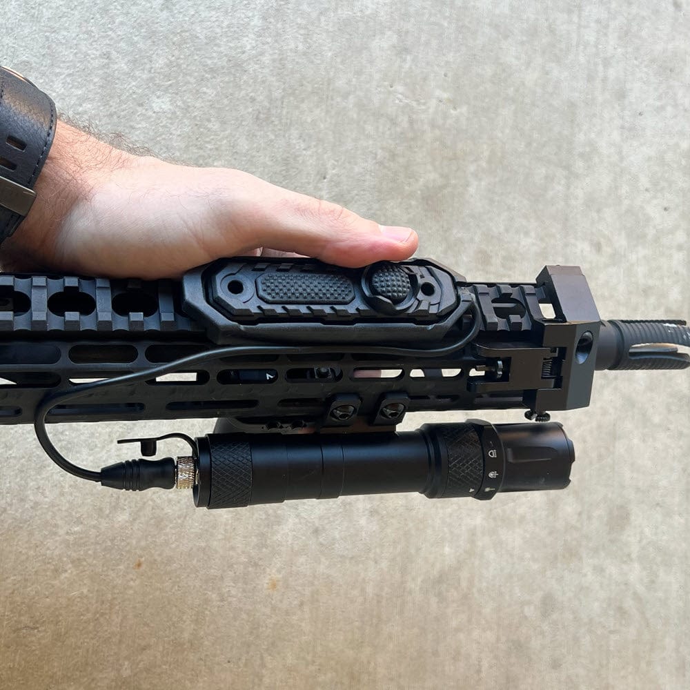 SFT2 Tactical RM19 Tac-Light weapon light with laser mounted on a firearm for tactical illumination and targeting.