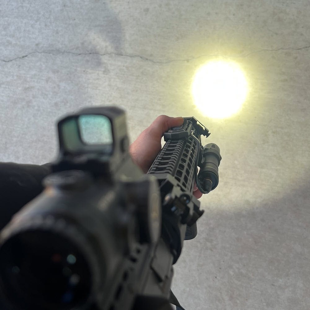 SFT2 Tactical RM19 Tac-Light weapon light with laser mounted on a firearm for tactical illumination and targeting.
