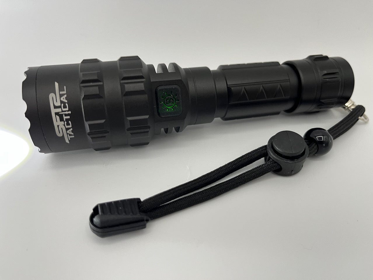 SFT2 Tactical multi-color flashlight with 1600 lumens, showcasing its mounted design and vibrant light options.
