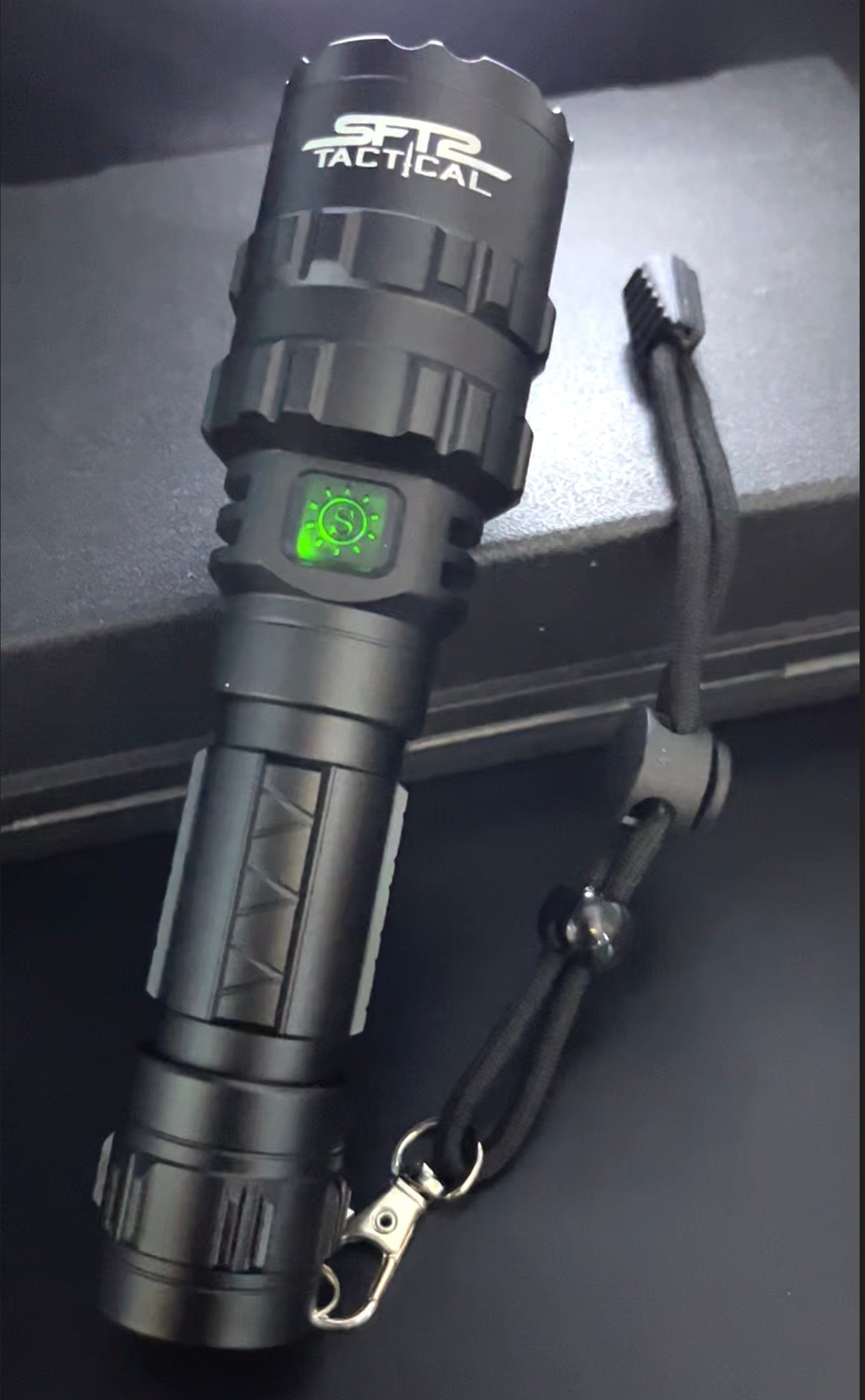 SFT2 Tactical multi-color flashlight with 1600 lumens, showcasing its durable design and bright illumination features.