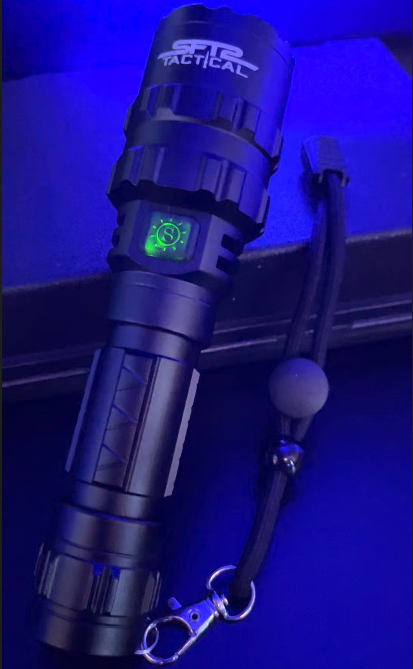 SFT2 Tactical multi-color flashlight with 1600 lumens, showcasing its durable design and adjustable light settings.
