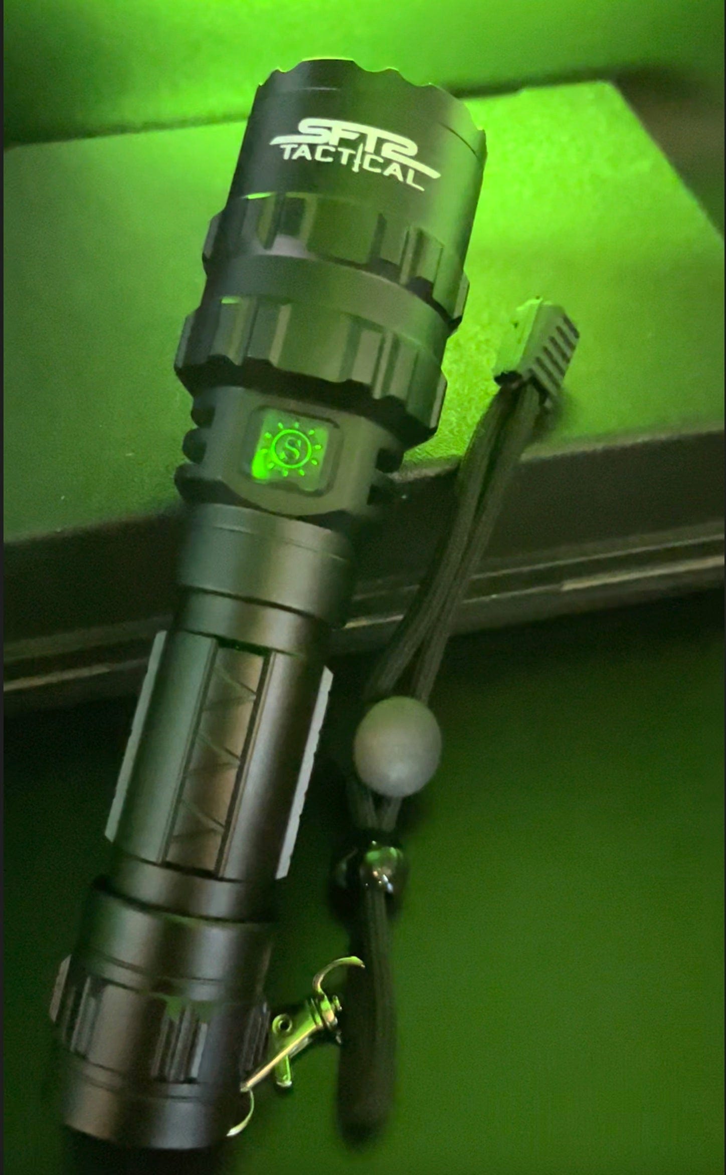 SFT2 Tactical multi-color flashlight, 1600 lumens, showcasing a compact design with a durable mount and vibrant light output.