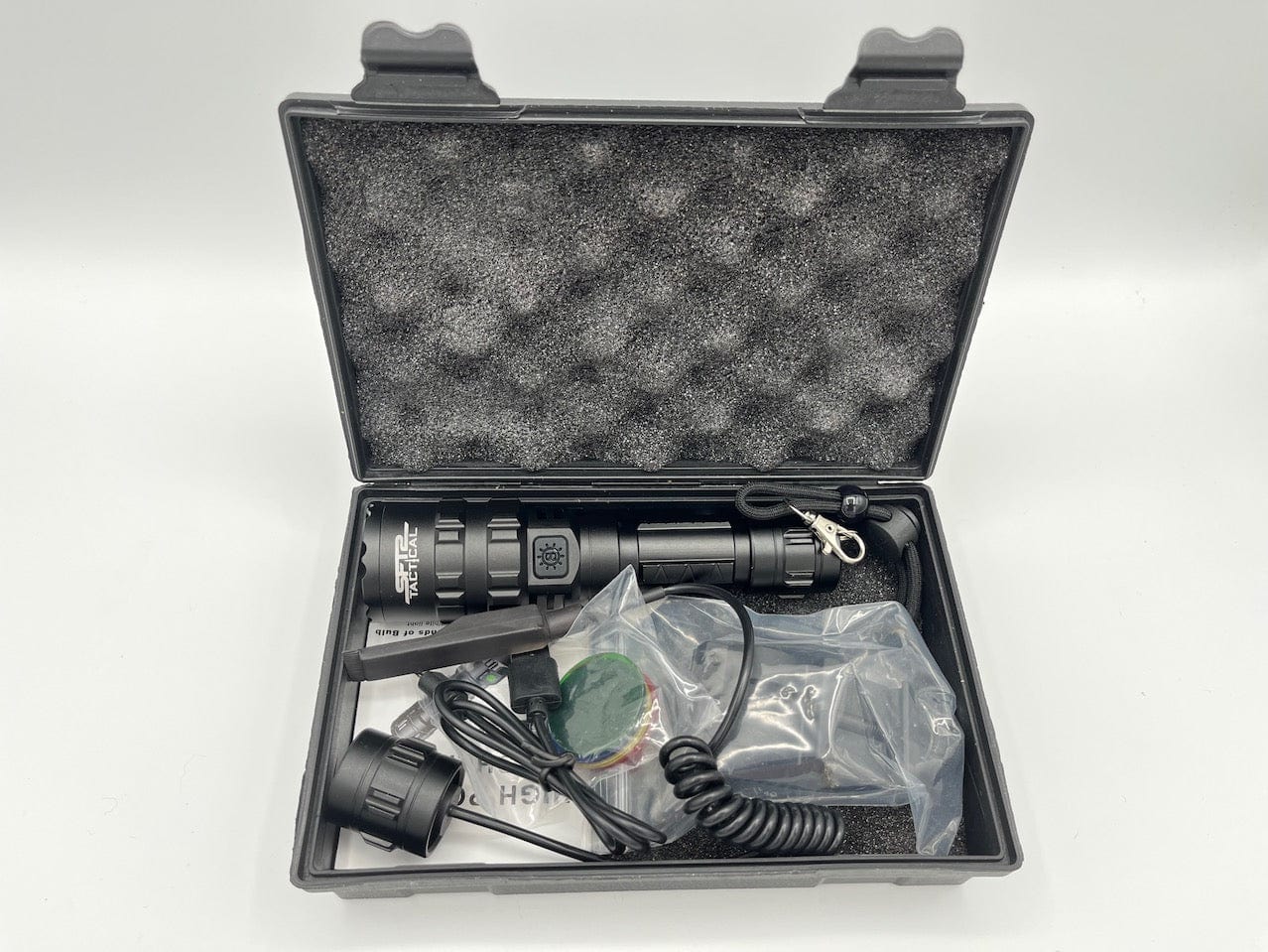 SFT2 Tactical multi-color flashlight with 1600 lumens, showcasing its durable design and bright LED light.