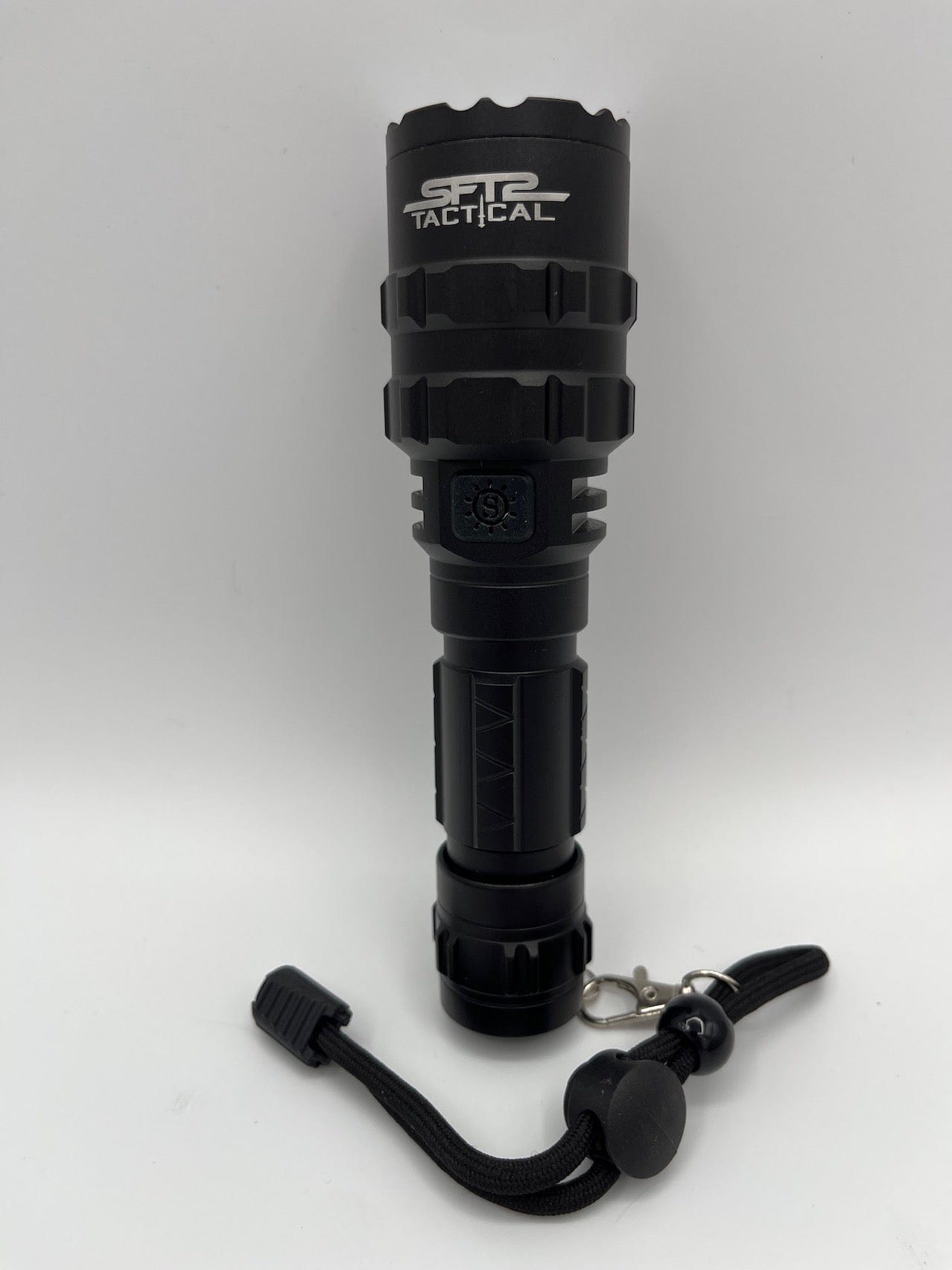 SFT2 Tactical multi-color flashlight with 1600 lumens, showcasing its compact design and mounted light features.