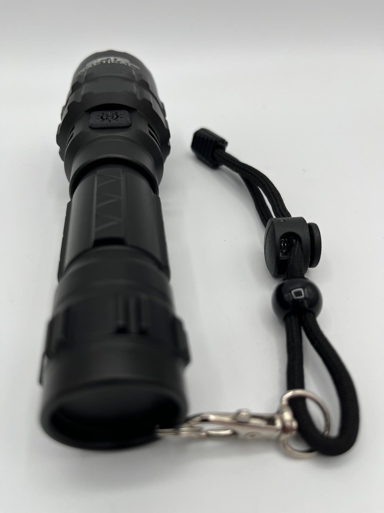 SFT2 Tactical multi-color flashlight with 1600 lumens, showcasing its durable design and bright illumination features.