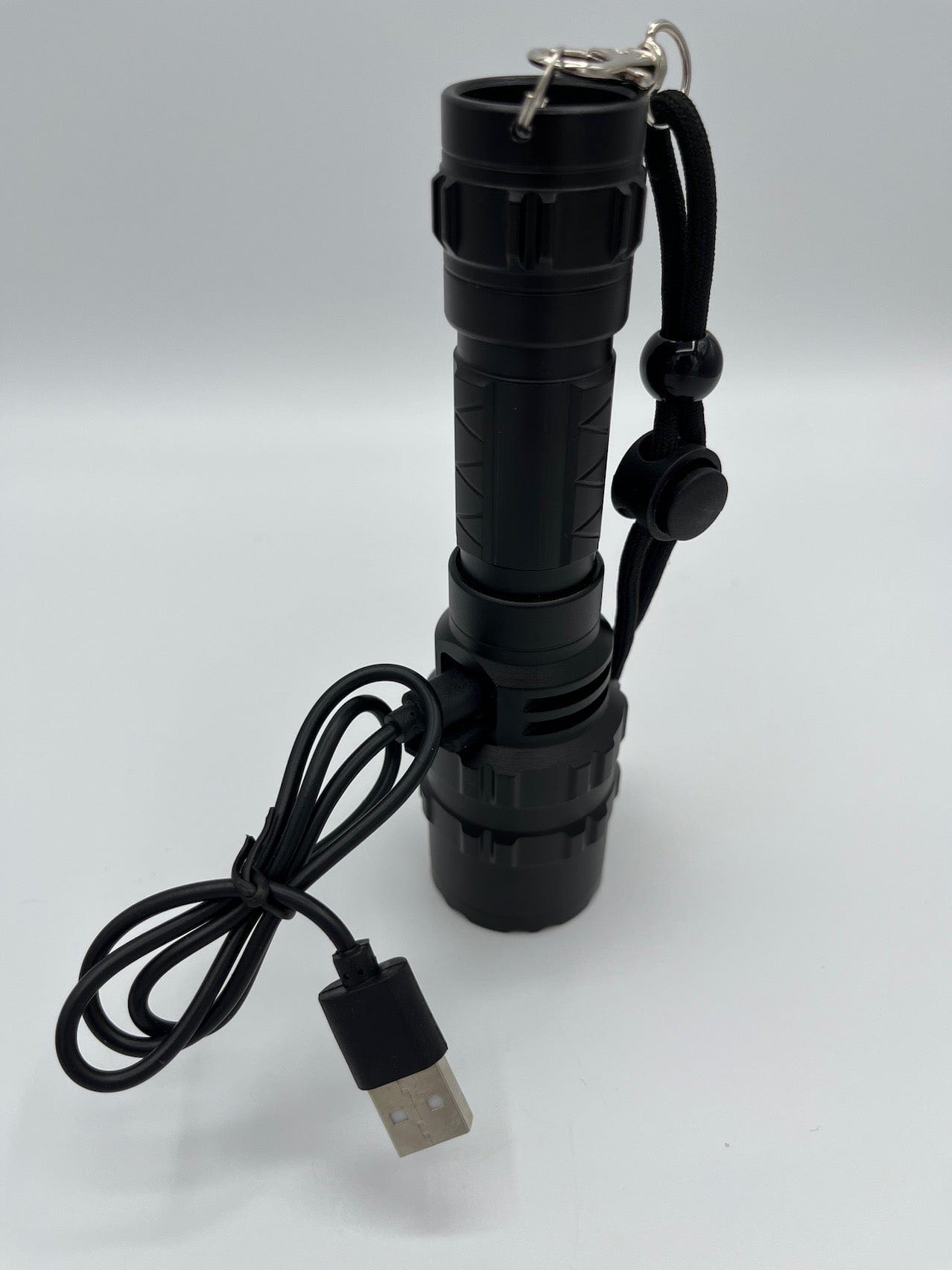 SFT2 Tactical multi-color flashlight with 1600 lumens, showcasing its compact design and mounted light features.