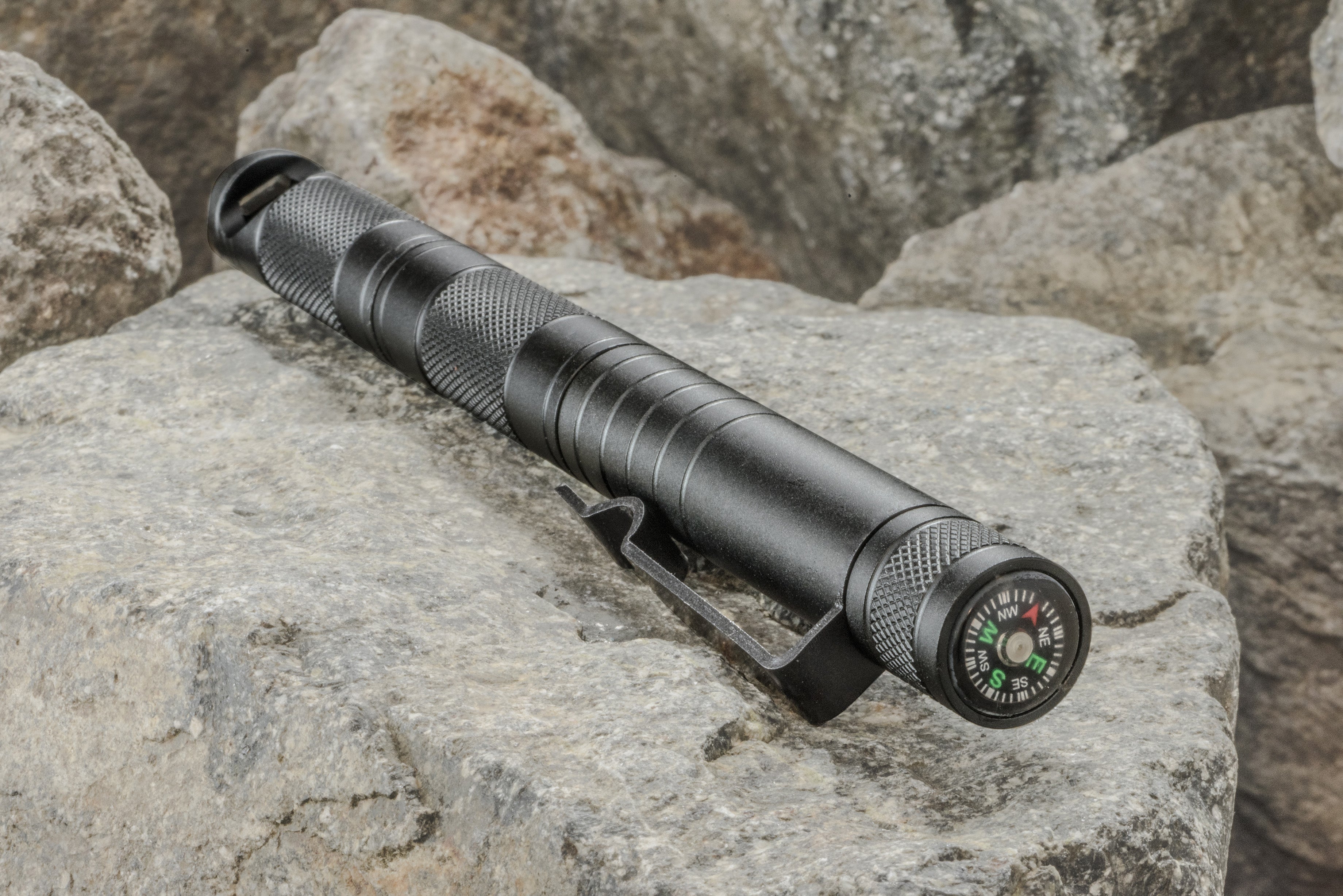 Compact 5-in-1 survival tool with tactical pen, flint starter, and multiple functions, ideal for outdoor emergencies and survival kits.