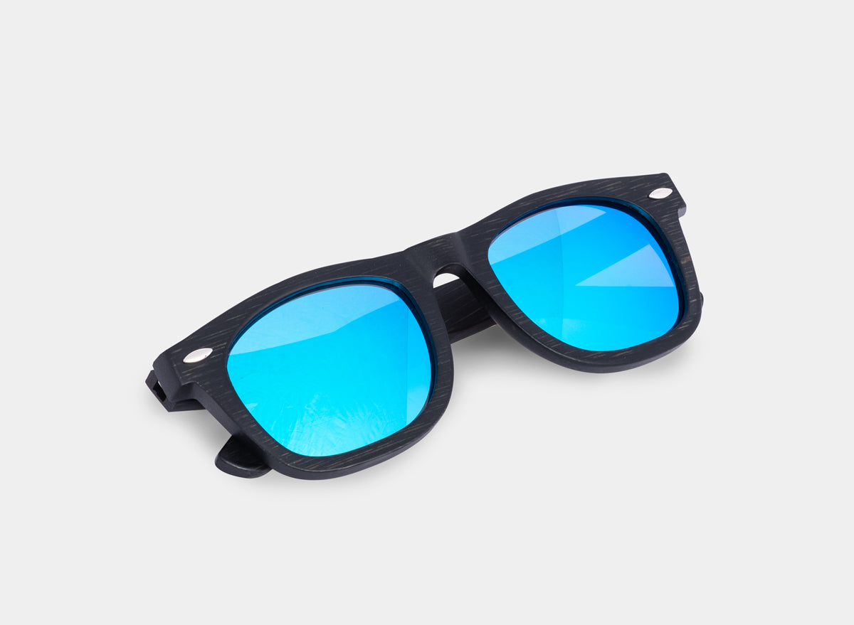 Floating bamboo sunglasses by Eastern Outer with black and blue tinted lenses, showcasing stylish eyewear on a white background.