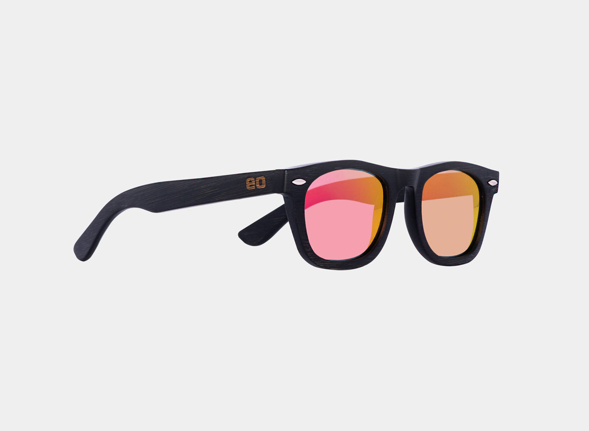 Bamboo floating sunglasses by Eastern Outer with black and pink frames, designed to float on water.