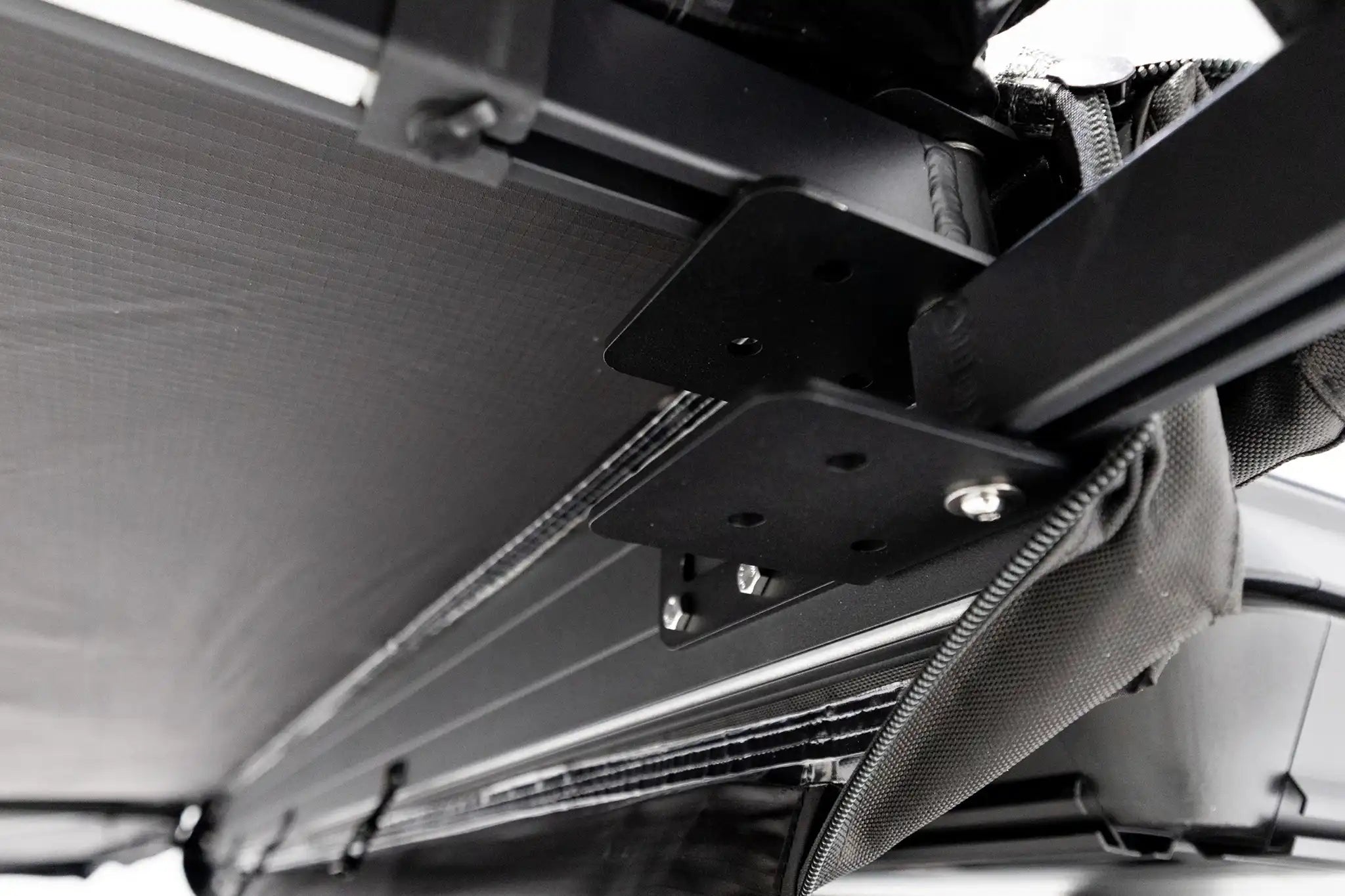 Freespirit Recreation 180 Awning V2 attached to a vehicle, showcasing its extended fabric coverage and sturdy mounting.