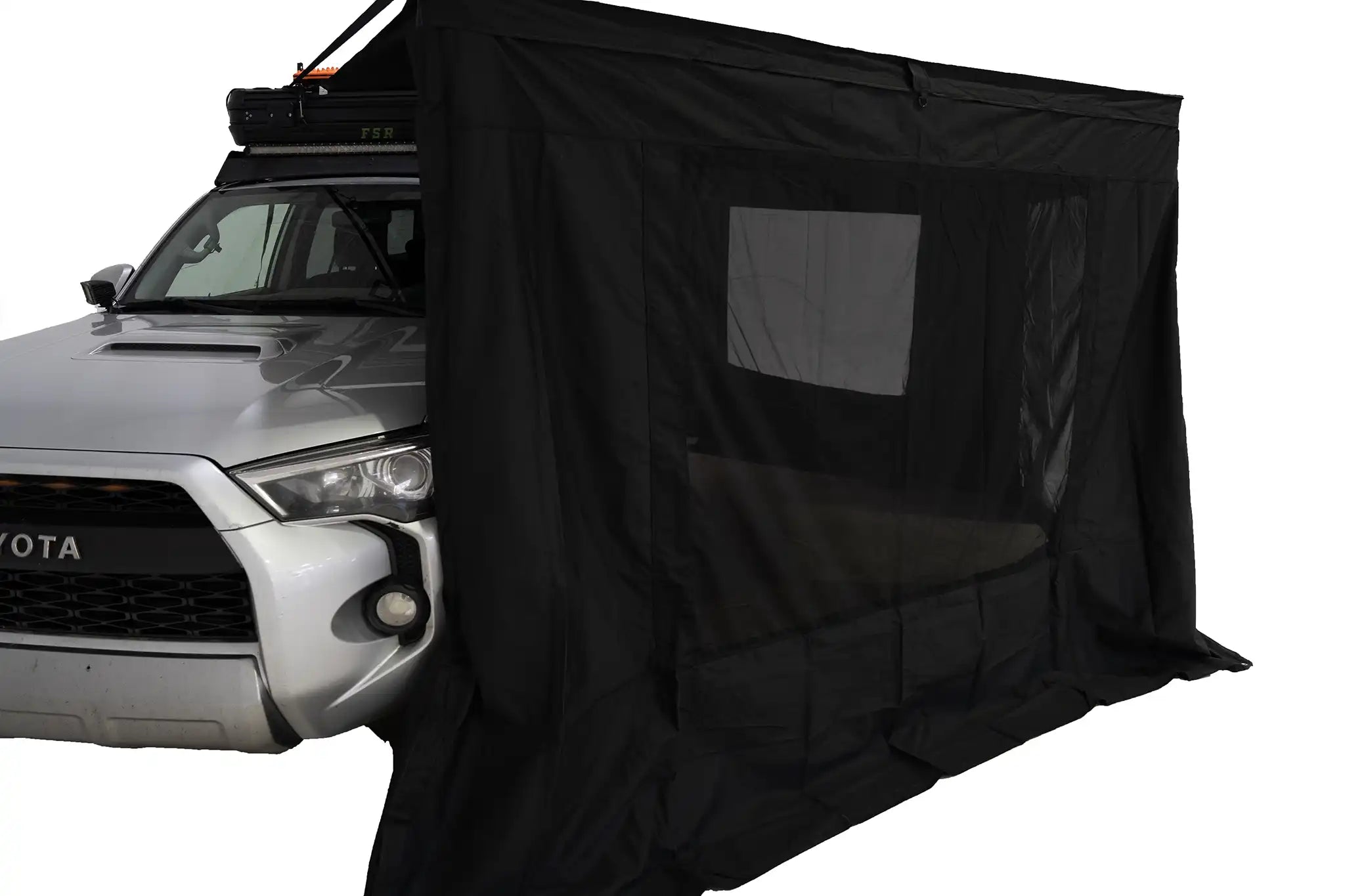 Freespirit Recreation 180 Awning Walls with windows set up, providing shelter and shade for outdoor adventures.