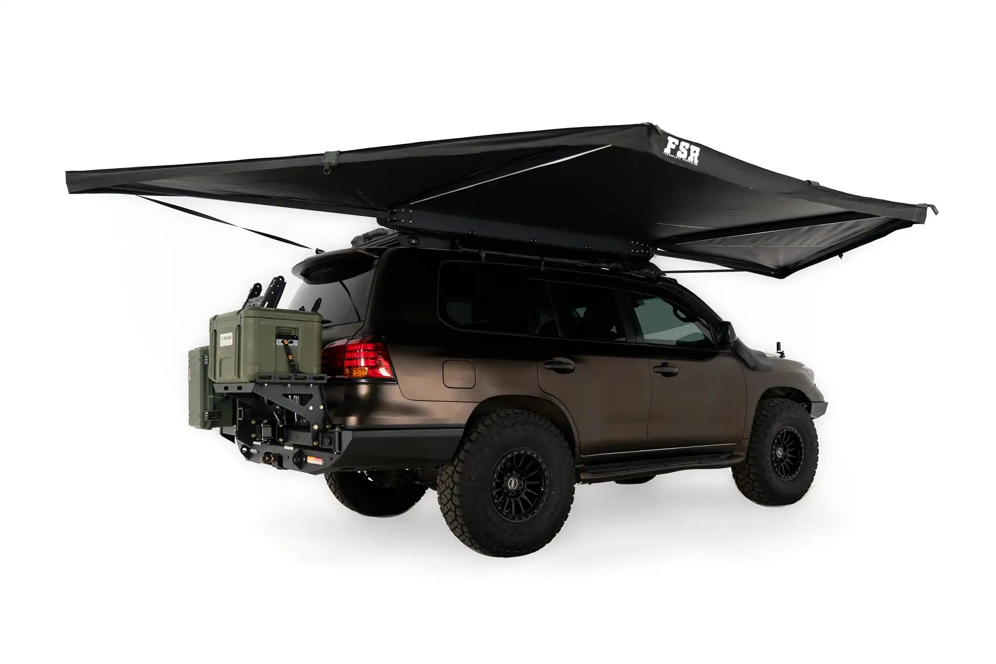 Freespirit Recreation 180 Awning V2 extended over a vehicle, showcasing its spacious canopy and sturdy support structure.