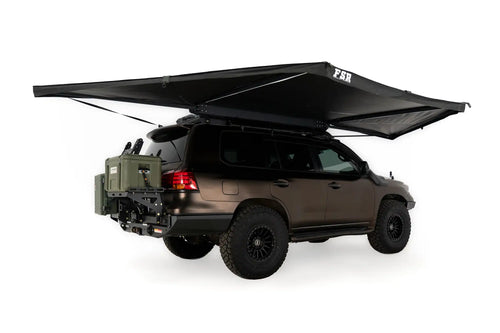 Freespirit Recreation 180 Awning V2 extended over a vehicle, showcasing its spacious canopy and sturdy support structure.