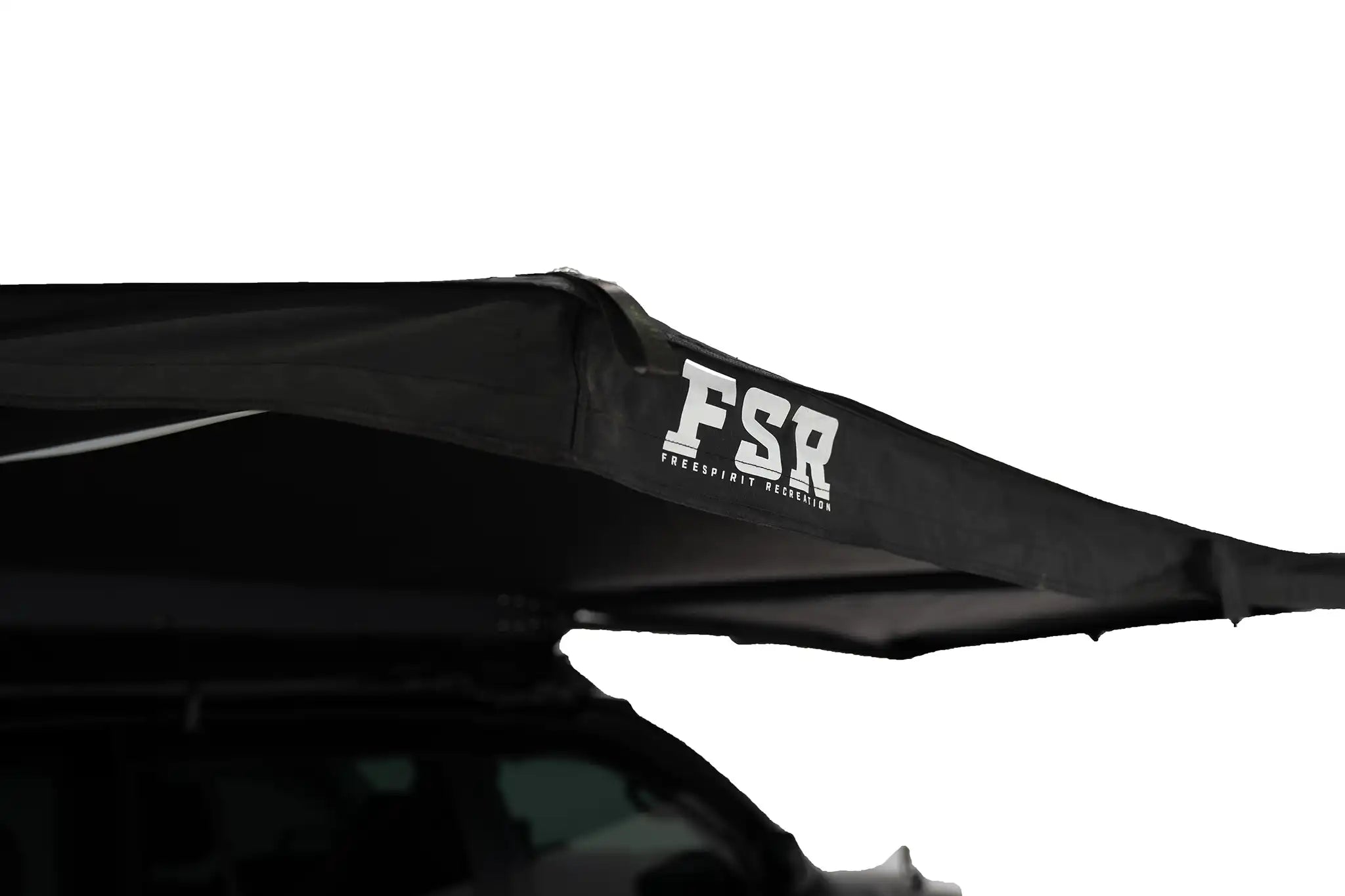 Freespirit Recreation 180 Awning V2, free-standing camping awning with extended fabric and sturdy support poles, set up outdoors.