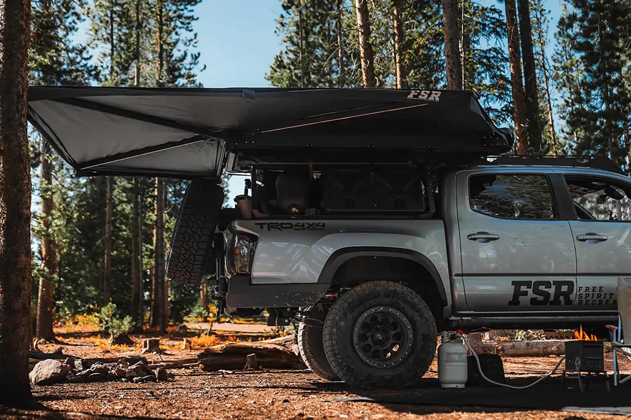 Freespirit Recreation 270 Awning V2 setup showing durable fabric and supporting poles for outdoor shade and weather protection.