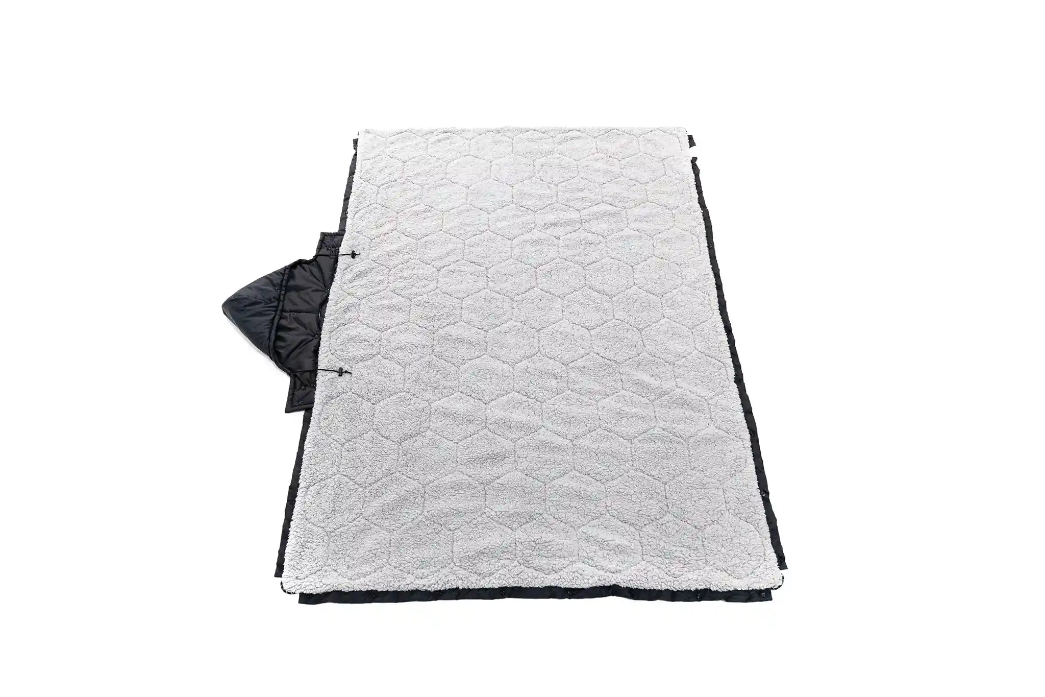Freespirit Recreation Anywhere Poncho camping blanket with inner lining, outdoor outerwear for warmth and comfort during outdoor activities.