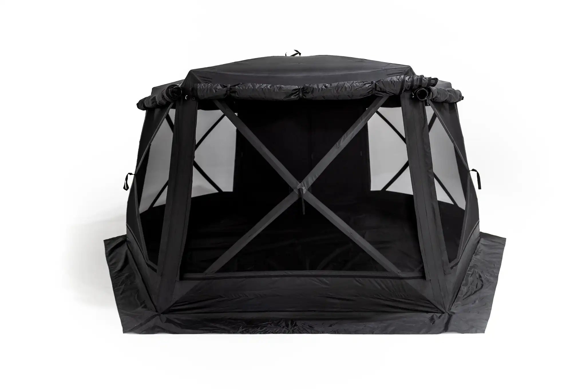 Freespirit Recreation Hub 6XL Tent opened in a campsite, showcasing spacious interior and durable fabric.