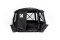 Freespirit Recreation Hub 6XL tent set up in a campsite, showcasing spacious design and sturdy structure for camping trips.