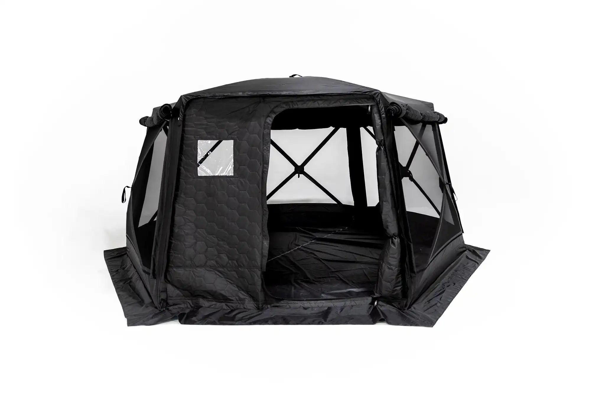 Freespirit Recreation Hub 6XL tent set up in a campsite, showcasing spacious design and sturdy structure for camping trips.