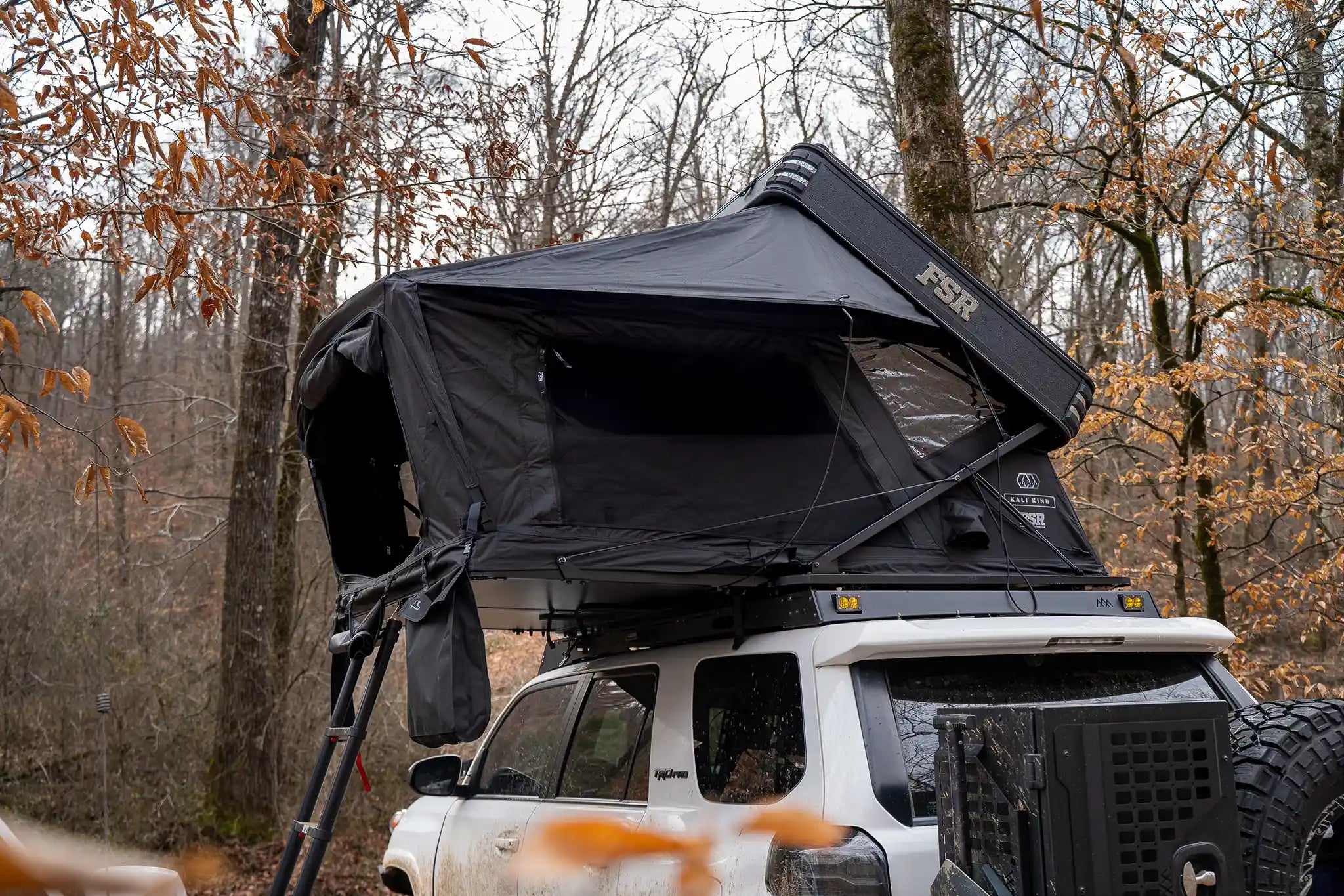 Open Freespirit Recreation Kali King rooftop tent set up on a vehicle, showcasing its spacious design and sturdy build.