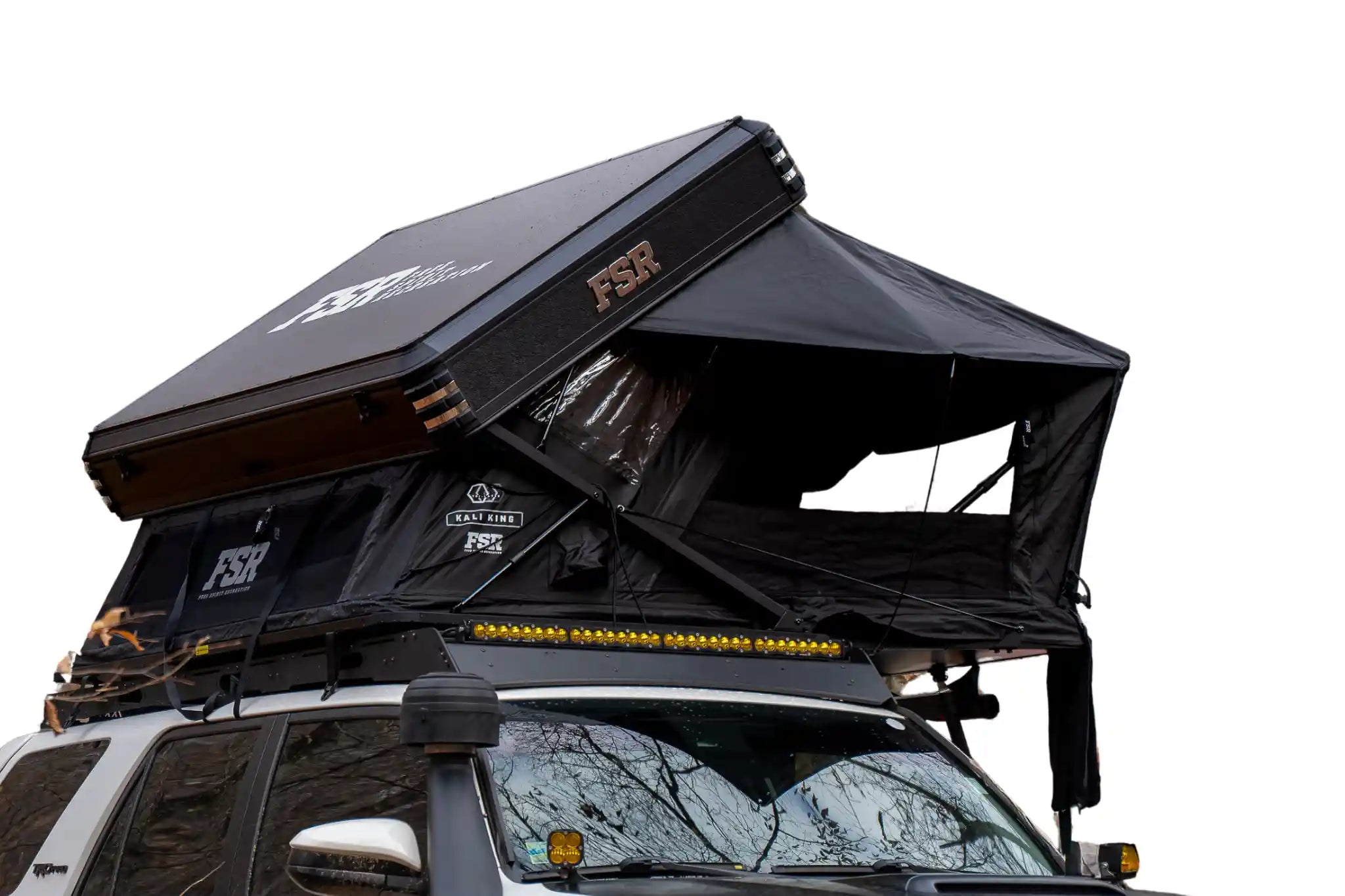 Freespirit Recreation Kali King rooftop tent set up on a vehicle, featuring durable fabric and comfortable sleeping area.