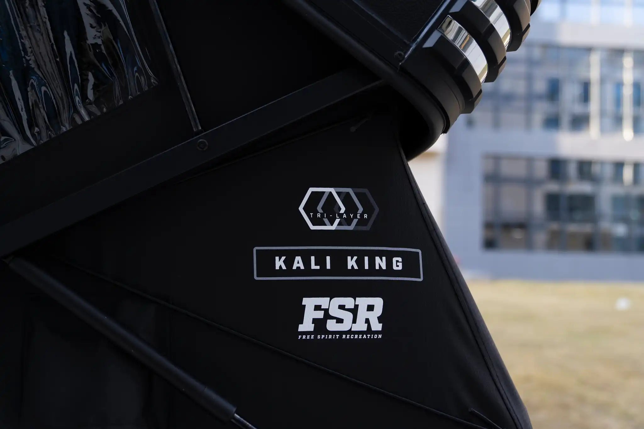 Freespirit Recreation Kali King rooftop tent mounted on vehicle, showcasing durable fabric and spacious design for outdoor camping.