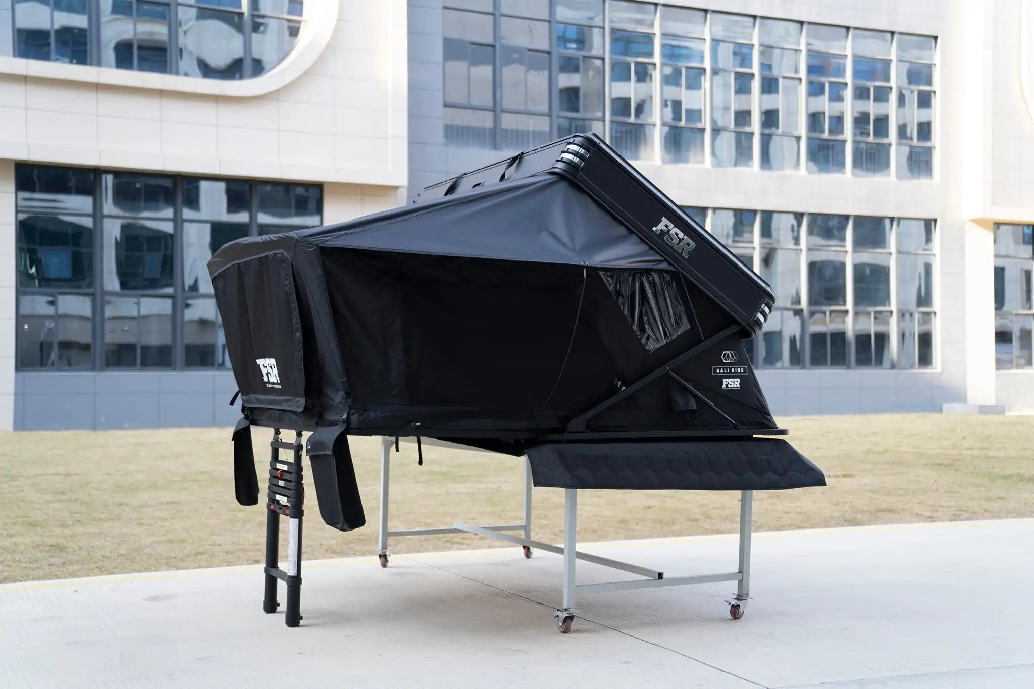 Freespirit Recreation Kali King rooftop tent deployed on vehicle, showcasing its spacious interior and waterproof fabric for camping adventures.