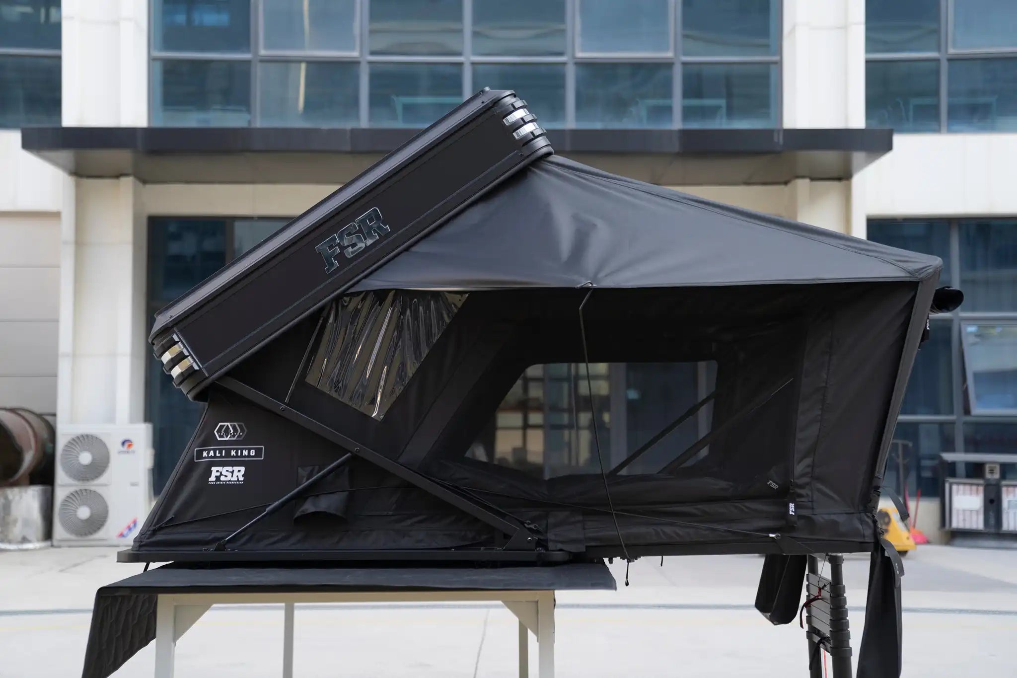 Side profile of Freespirit Recreation Kali King rooftop tent mounted on a vehicle, showcasing its sturdy frame and spacious design.