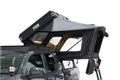 Freespirit Recreation Kali rooftop tent set up on a vehicle, showcasing its sturdy fabric and side view for outdoor camping adventures.