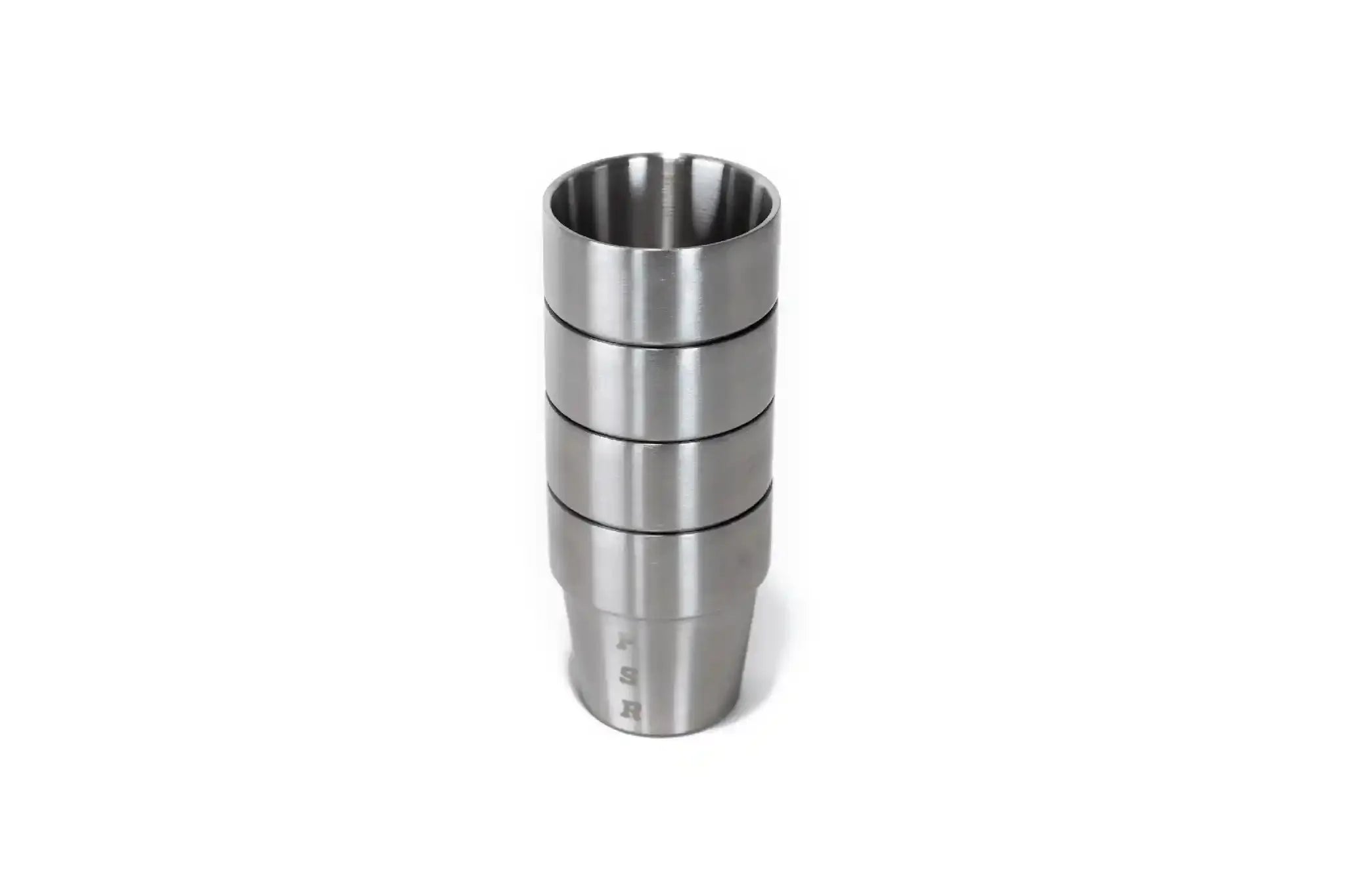 Set of four stainless steel whiskey cups by Freespirit Recreation, stacked and arranged for display in kitchenware collection.