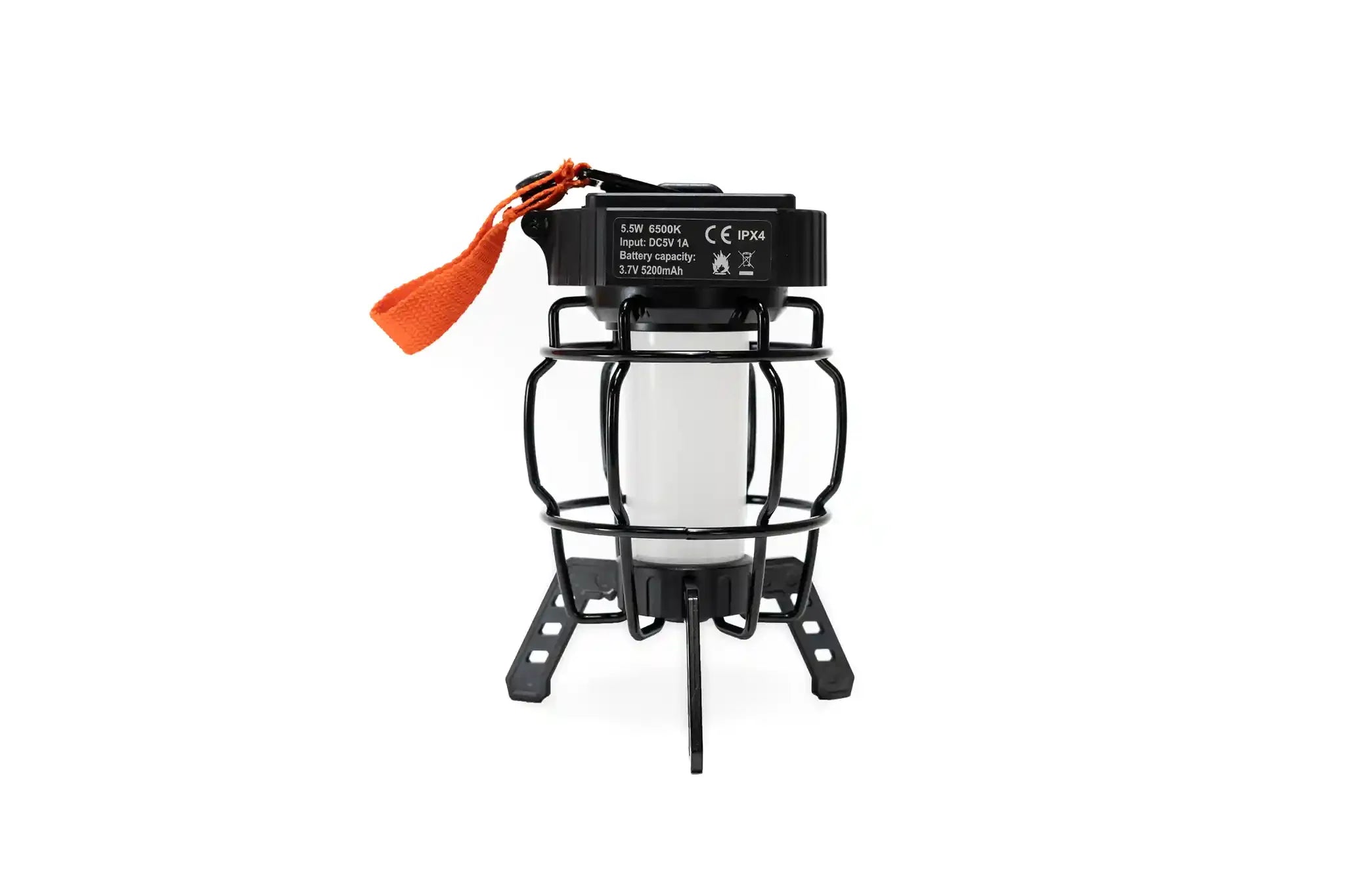 Freespirit Recreation portable LED camp lantern providing bright outdoor lighting, shown in a camping setting with its compact design.