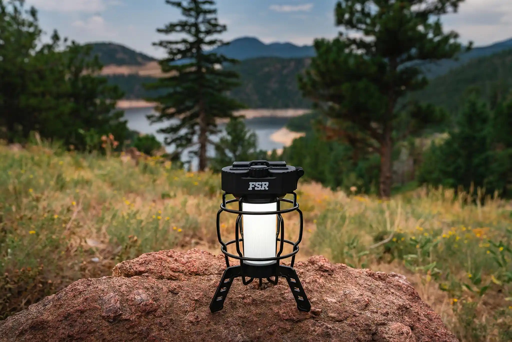 Freespirit Recreation portable LED camping lantern in use, providing bright light for outdoor camping and camping trips.