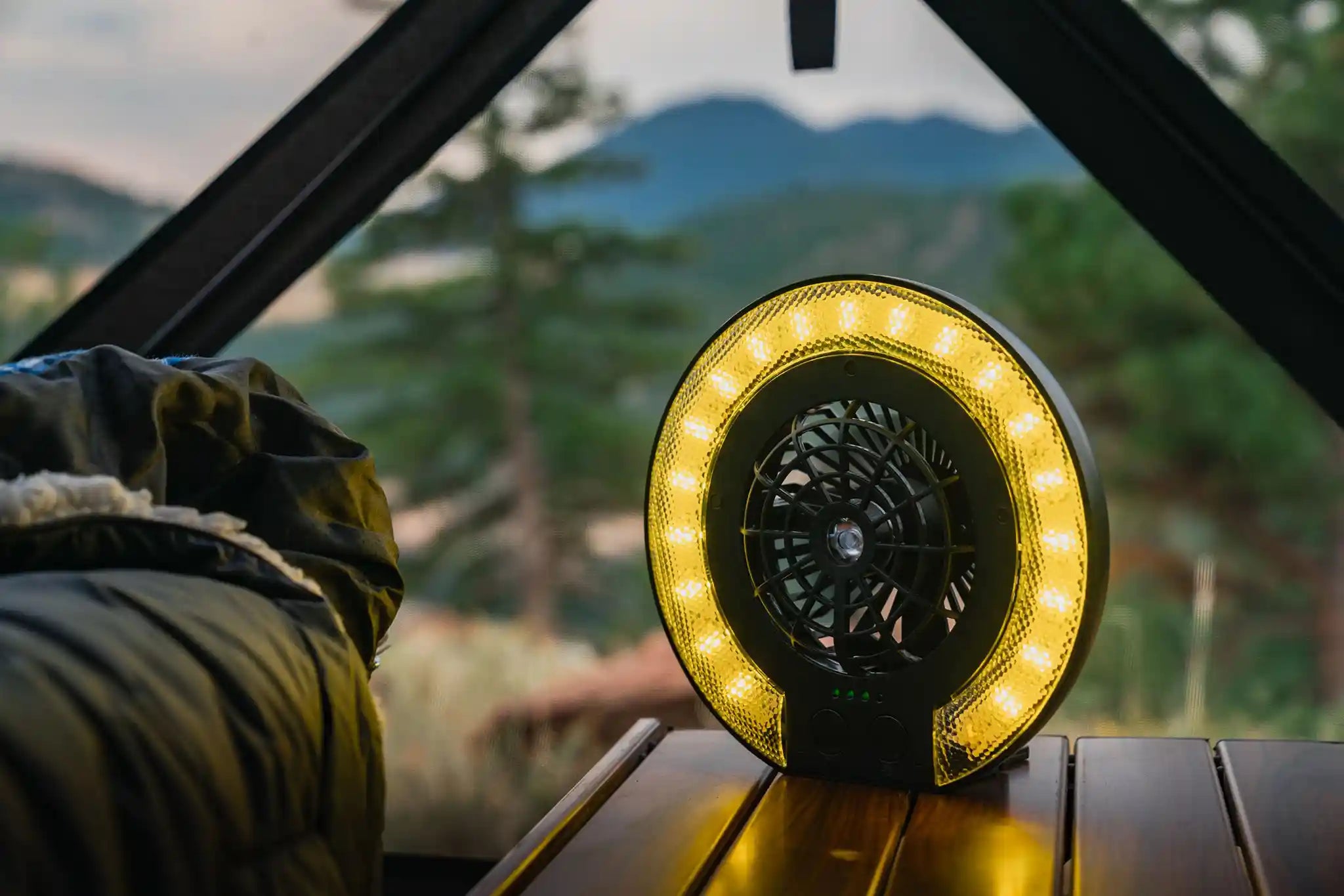 Freespirit Recreation LED Fan Lamp mounted inside a rooftop tent, providing illumination and airflow for outdoor camping adventures.