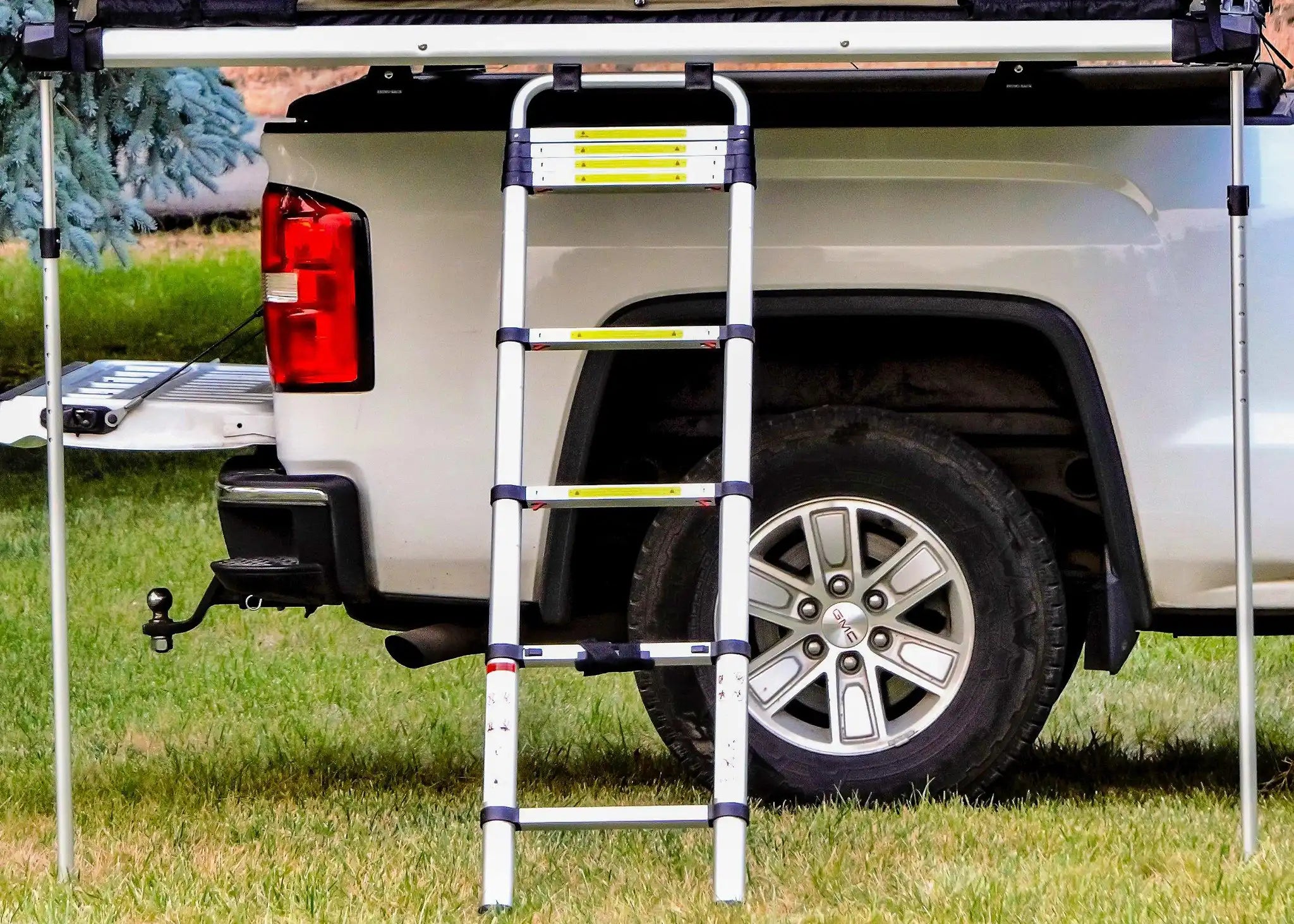Freespirit Recreation 10.5 Extra Long Stabilizer Pole supporting a high country tent with an awning extended.