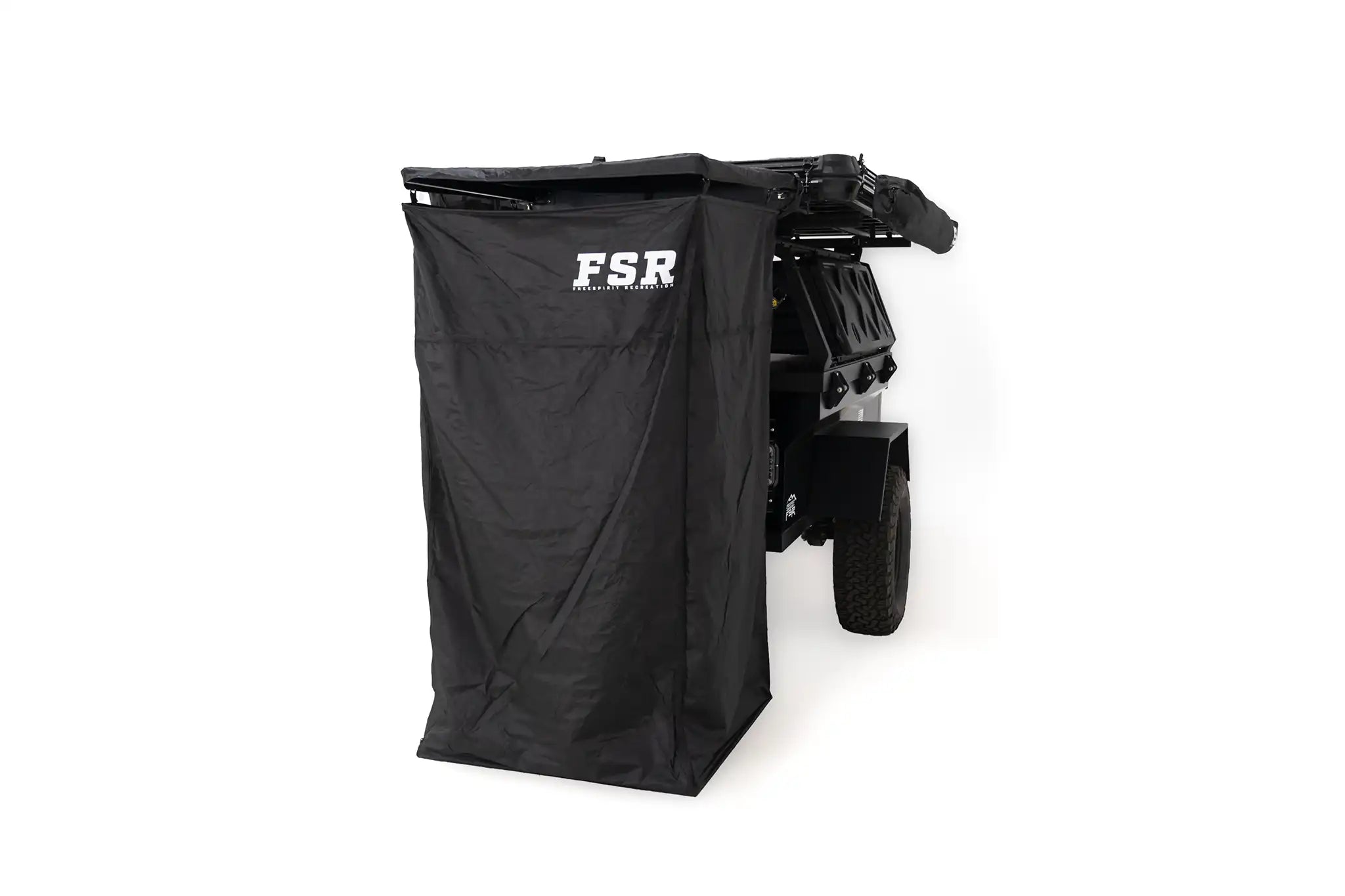 Freespirit Recreation shower awning set up outside, providing privacy for camping bathroom use in a natural setting.