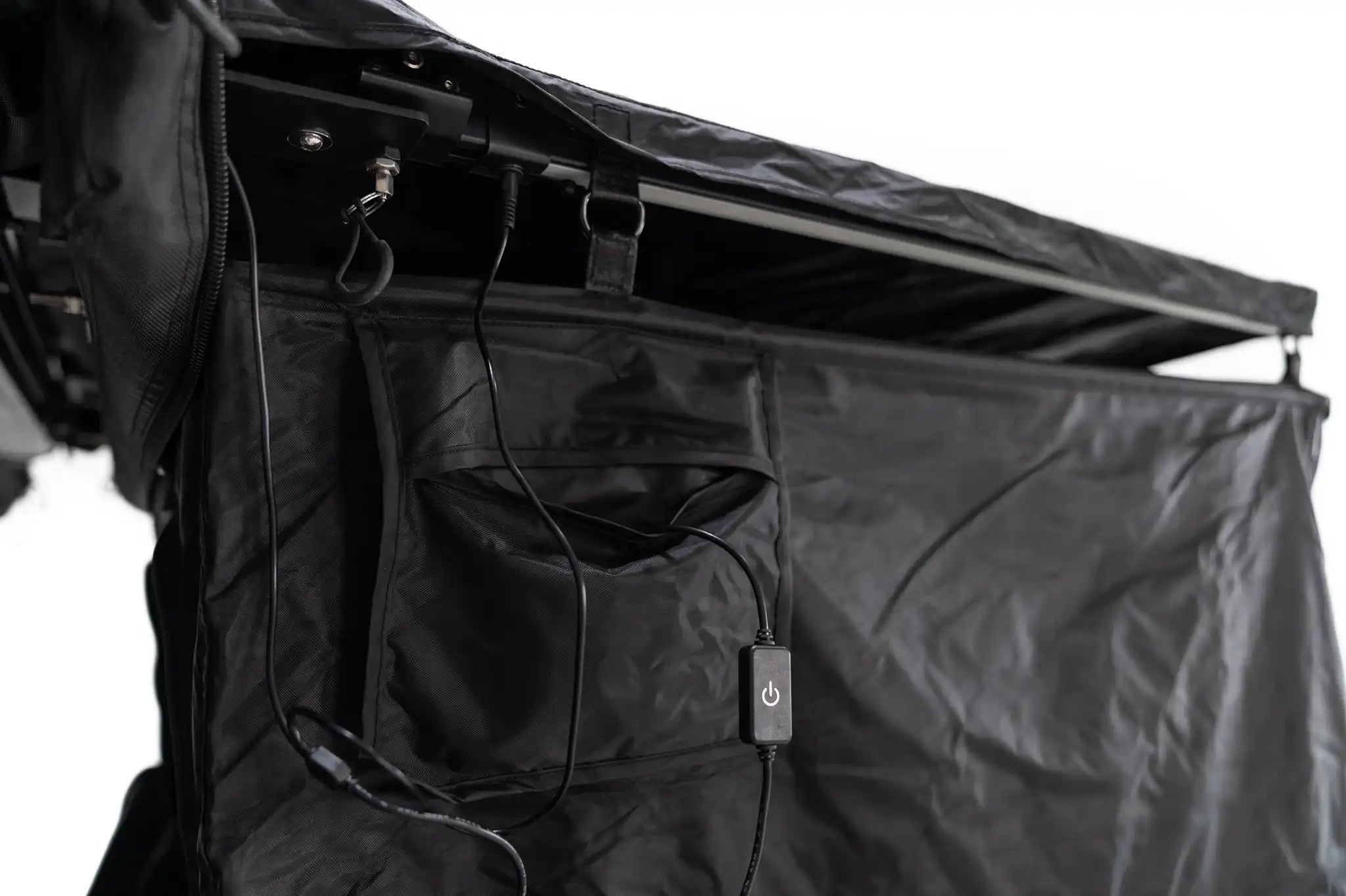Freespirit Recreation shower awning with light switch and battery pocket displayed against a neutral background.