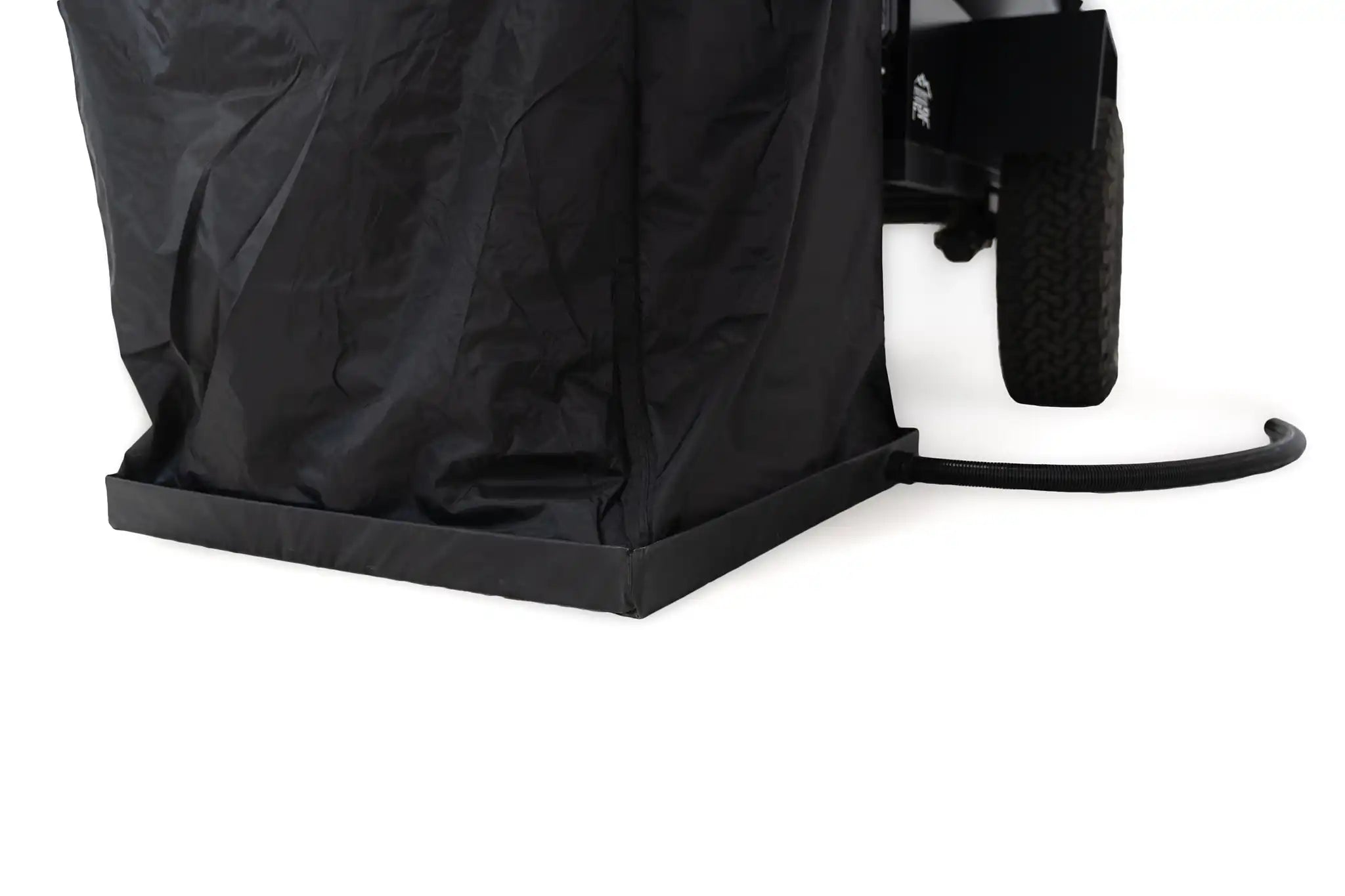 Freespirit Recreation shower awning with floor pan and drain hose, set up outdoors for camping or outdoor use.
