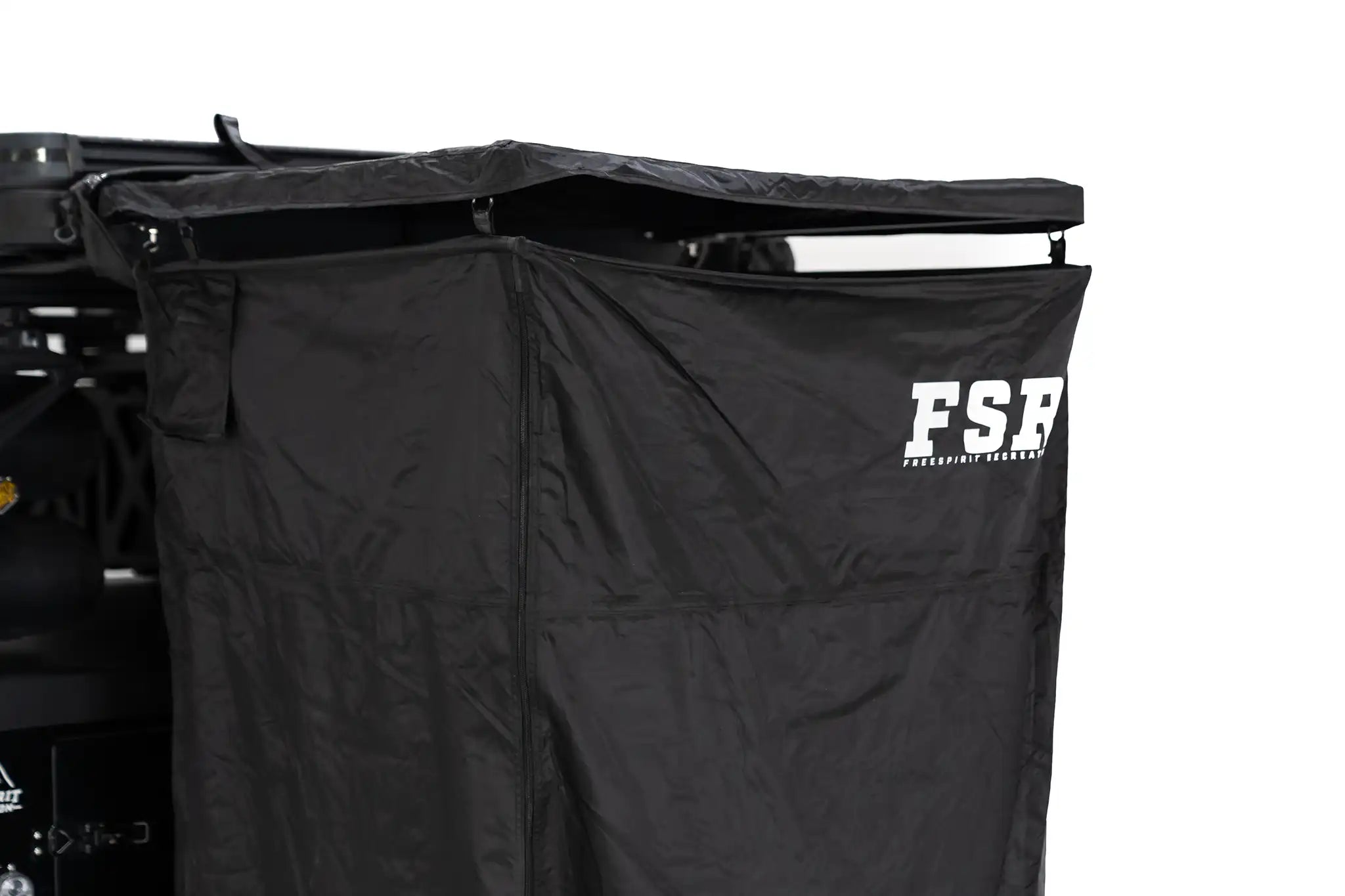 Freespirit Recreation shower awning with roof, providing shade and shelter for outdoor showers in a camping setup.
