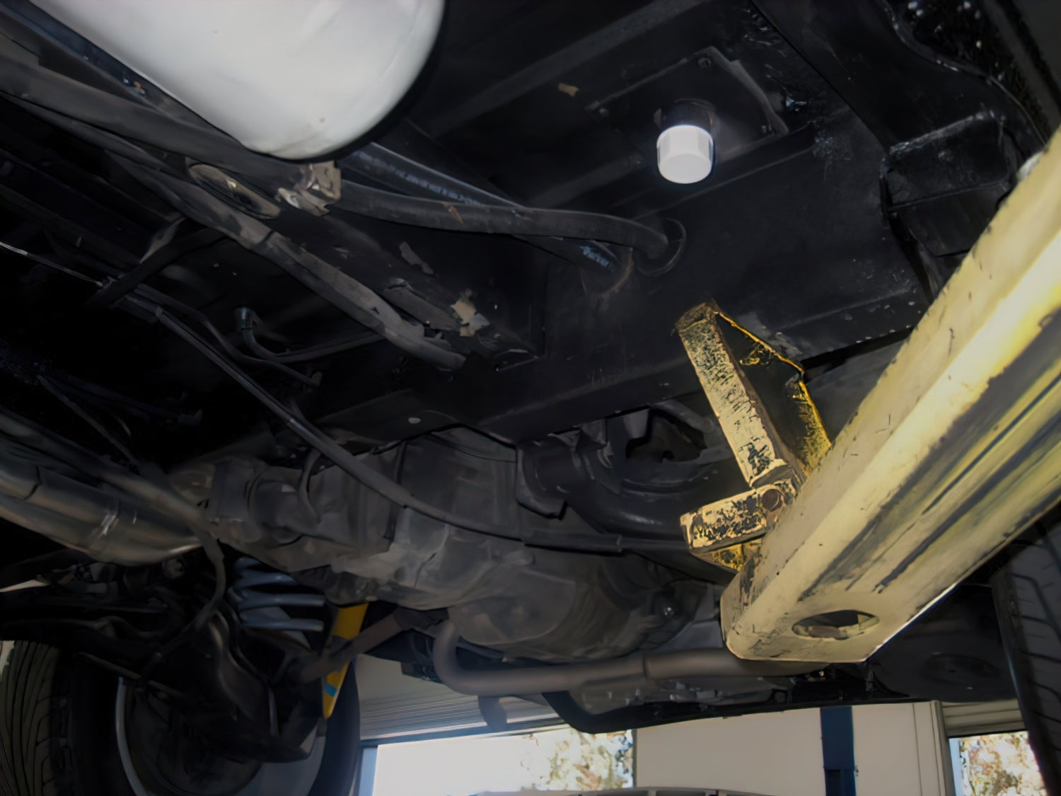 GoWesty fresh water tank drain cap shown on a vehicle, durable plastic cap designed for secure sealing of water tanks.