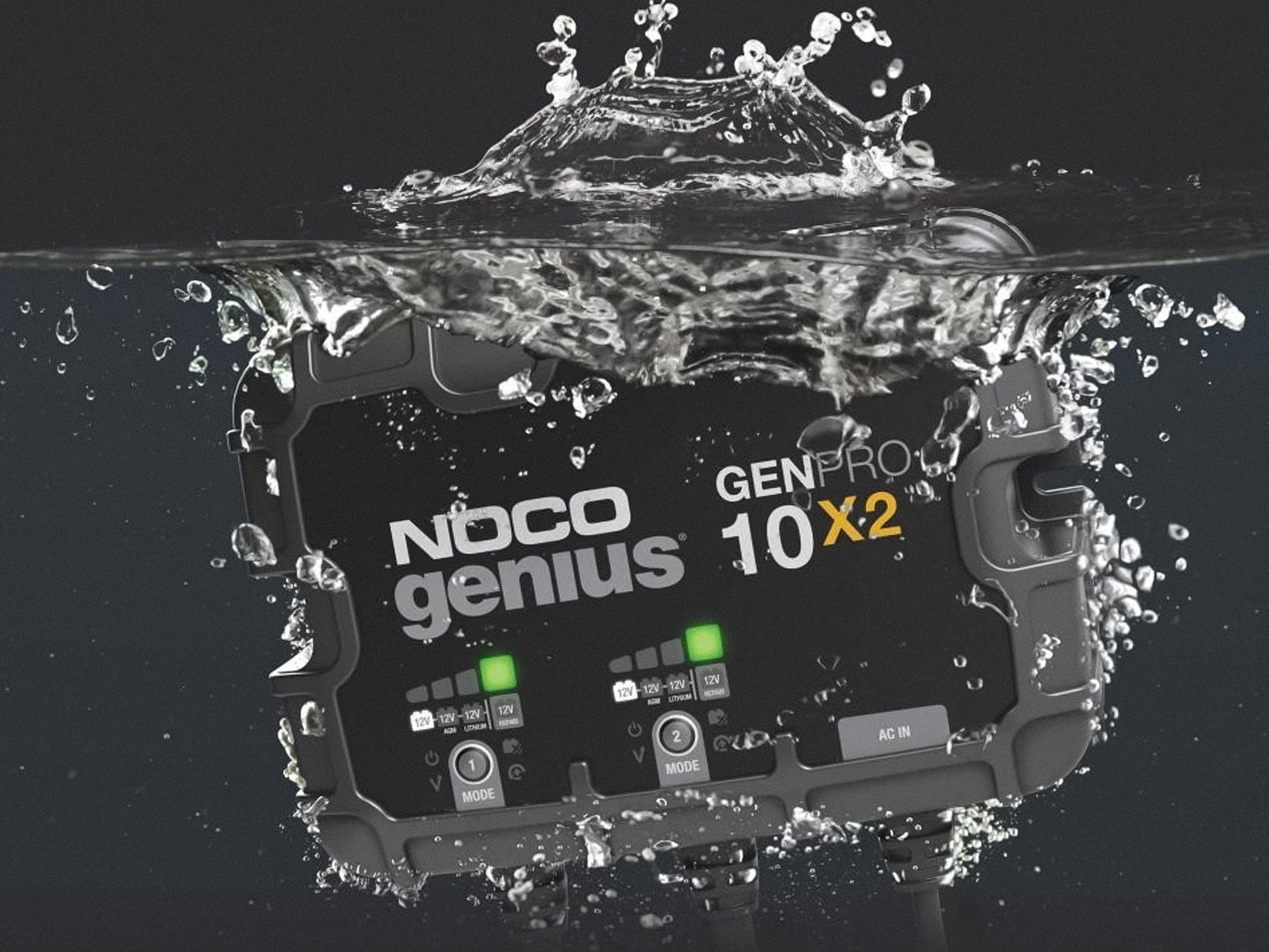 GoWesty Noco Genius GenPro10x2 battery charger connected to a vehicle battery with cables and digital display visible