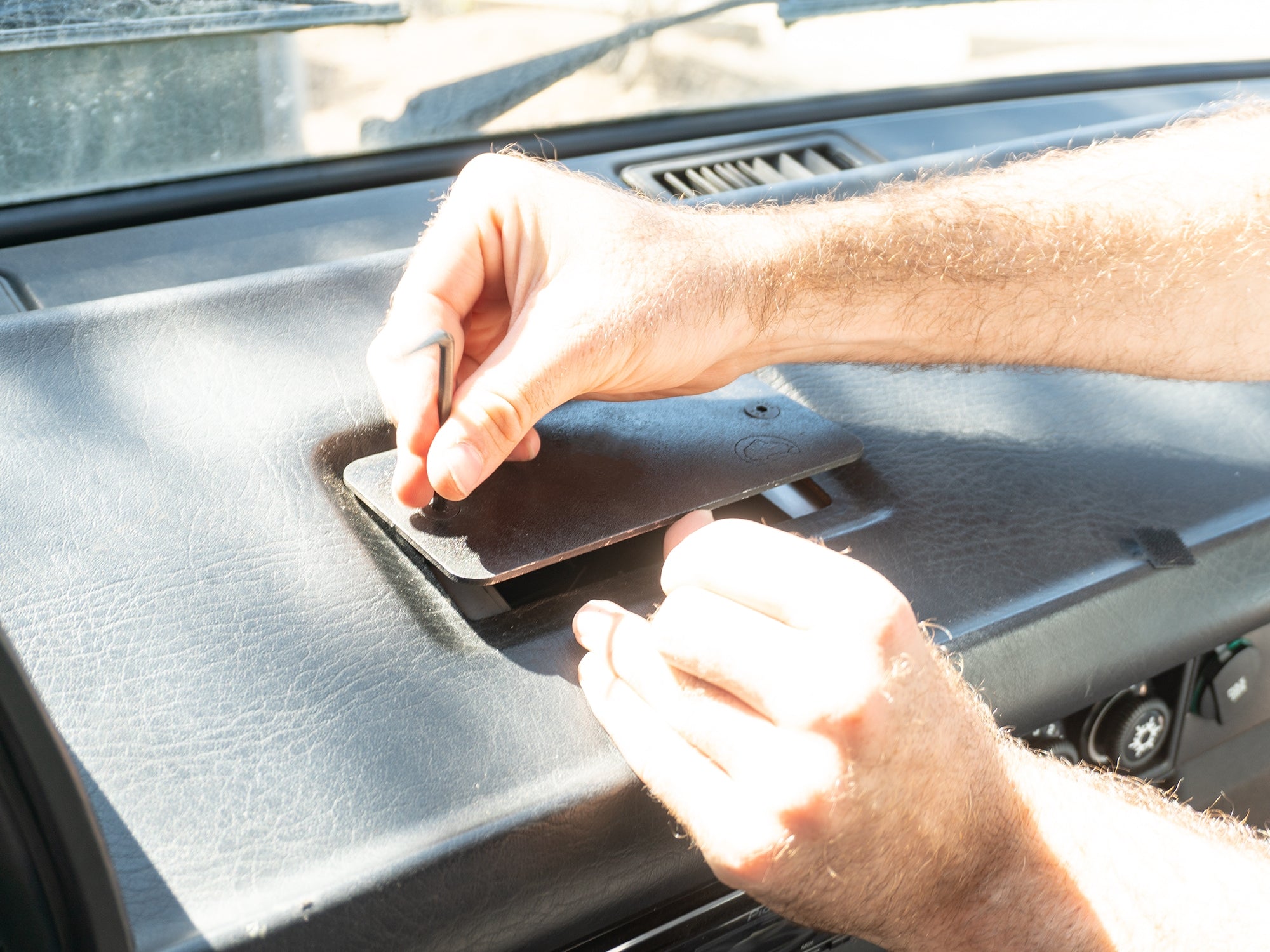 GoWesty Vanagon front ashtray delete kit showing the clean, black plastic cover installed in the vehicle's interior.