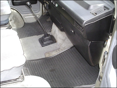 GoWesty rubber floor mats for Vanagon front seats, 2-piece set, durable black rubber with textured surface for all-weather protection.