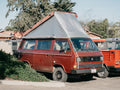 GoWesty Weather-Stopper Pop-Top Fly for Vanagon, durable fabric tent cover with mesh windows and secure attachment for camping.
